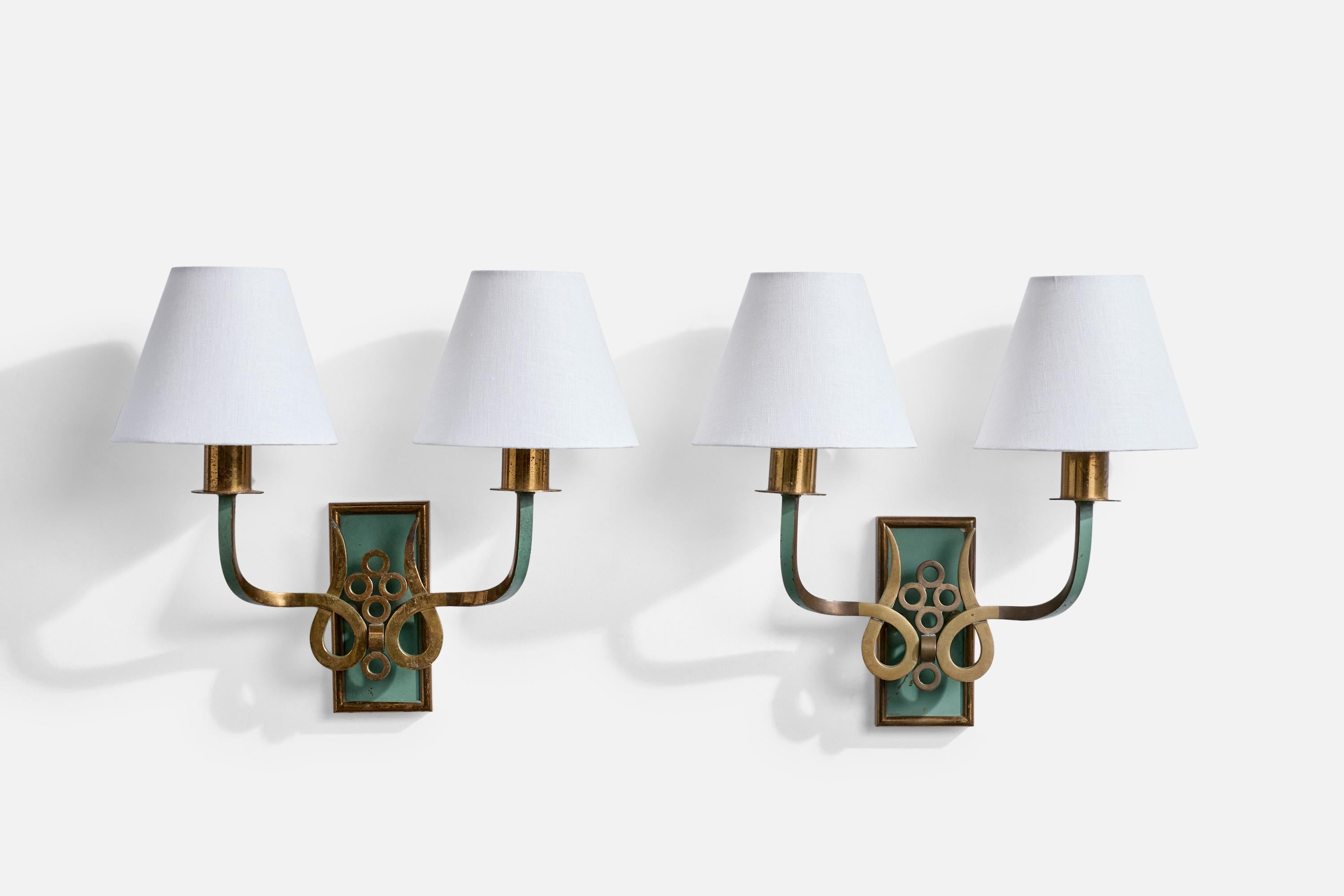 A pair of brass, green-lacquered metal and white fabric wall lights designed and produced in Italy, c. 1930s.

Light oxidation present on brass arms and sockets.

Overall Dimensions (Inches): 13” H x 13.5” W x 6.5“ D

Back Plate Dimensions (Inches):