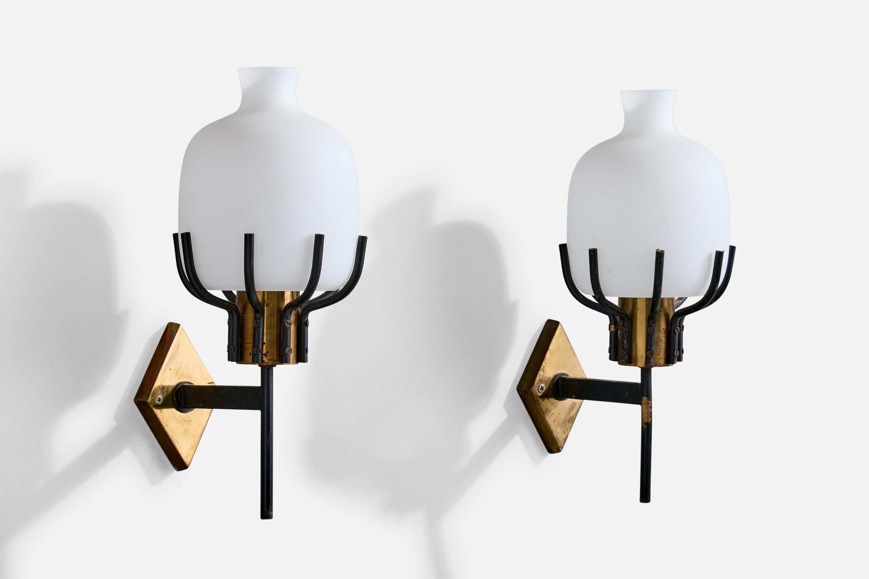 A pair of brass, black-lacquered metal and white opaline glass wall lights designed and produced in Italy, c. 1950s.

Oxidation is present on brass backplates and sockets and to metal arms.

Overall Dimensions (Inches): 11.25” H x 4.75” W x 6.375”