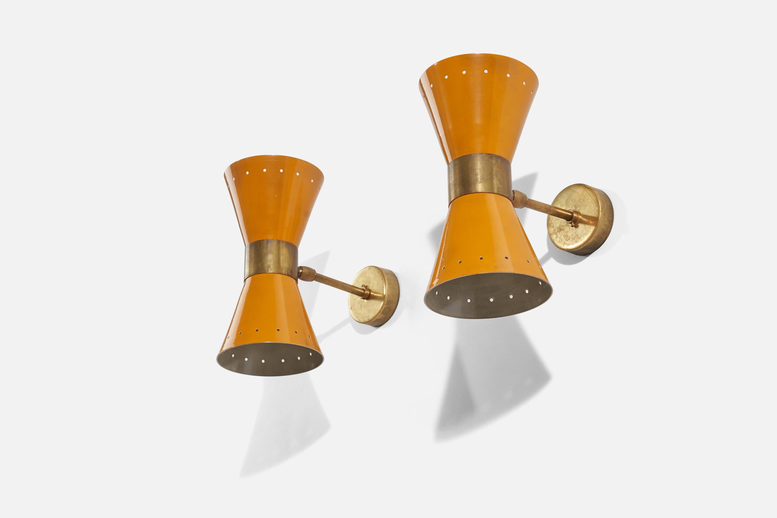 A pair of brass and yellow-orange metal wall lights designed and produced by an Italian designer, Italy, 1960s.