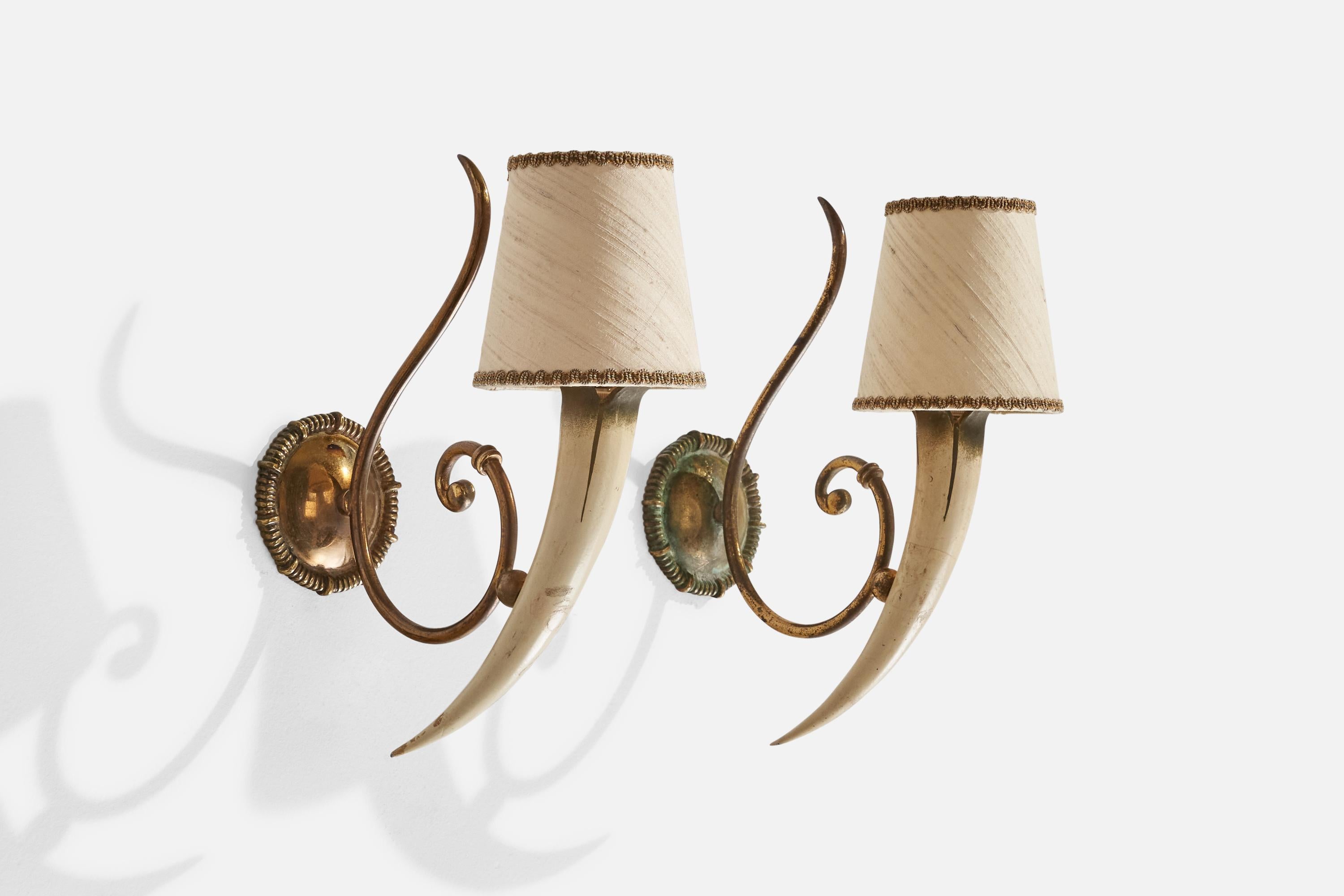 A pair of brass, painted resin and beige fabric lampshades designed and produced in Italy, 1940s.

Overall Dimensions (inches): 12” H x 4” W x 9.25” D
Back Plate Dimensions (inches): 3.5”  H x 3.5” W x .75” D
Bulb Specifications: E-14 Bulb
Number of