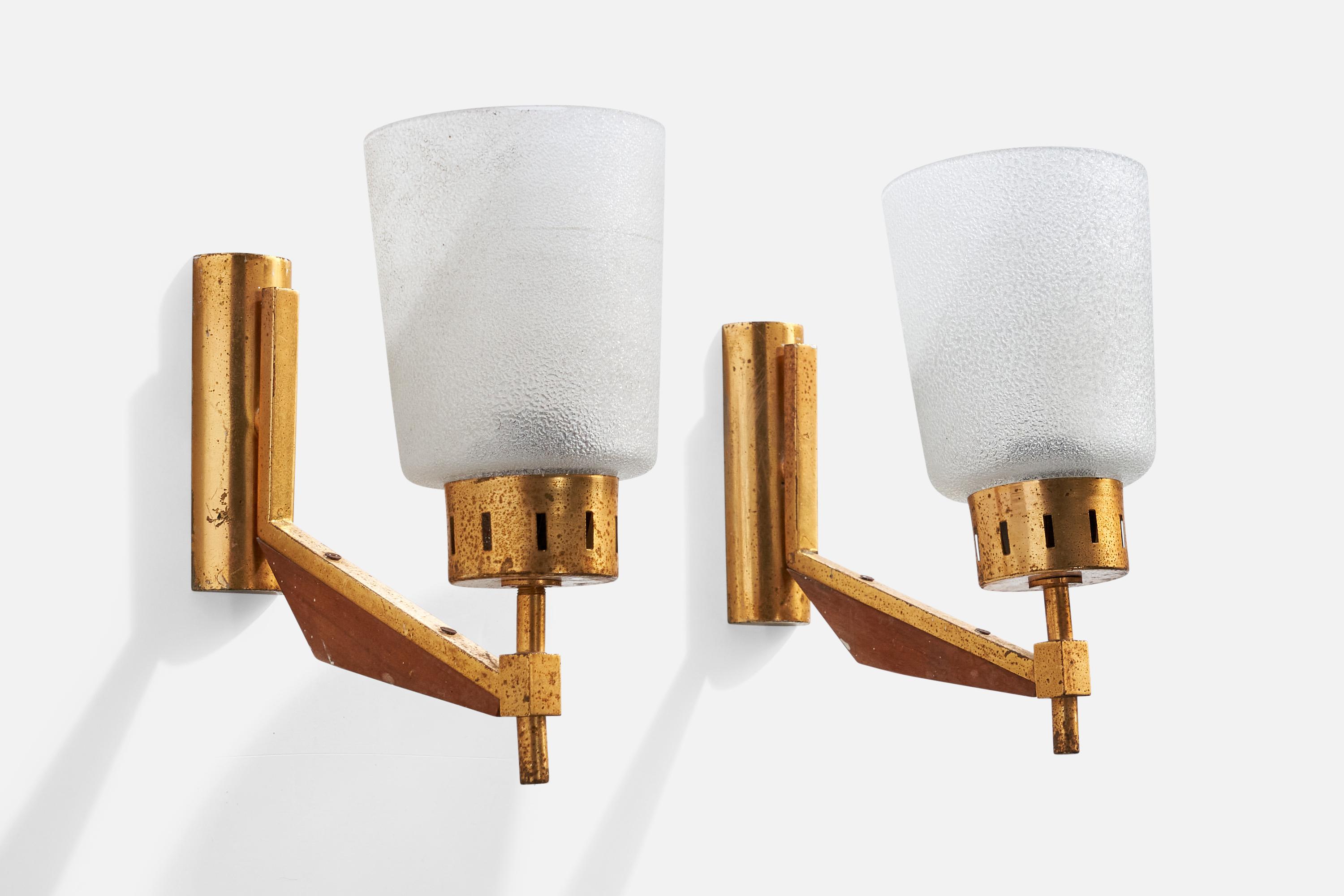 A pair of brass, teak and frosted glass wall lights designed and produced in Italy, c. 1950s.

Overall Dimensions (inches):  8.25” H x  4” W x  8.5“ D

Back Plate Dimensions (Inches):  4.875” H x 1.625” W x .75” D

Bulb Specifications: E-14

Number