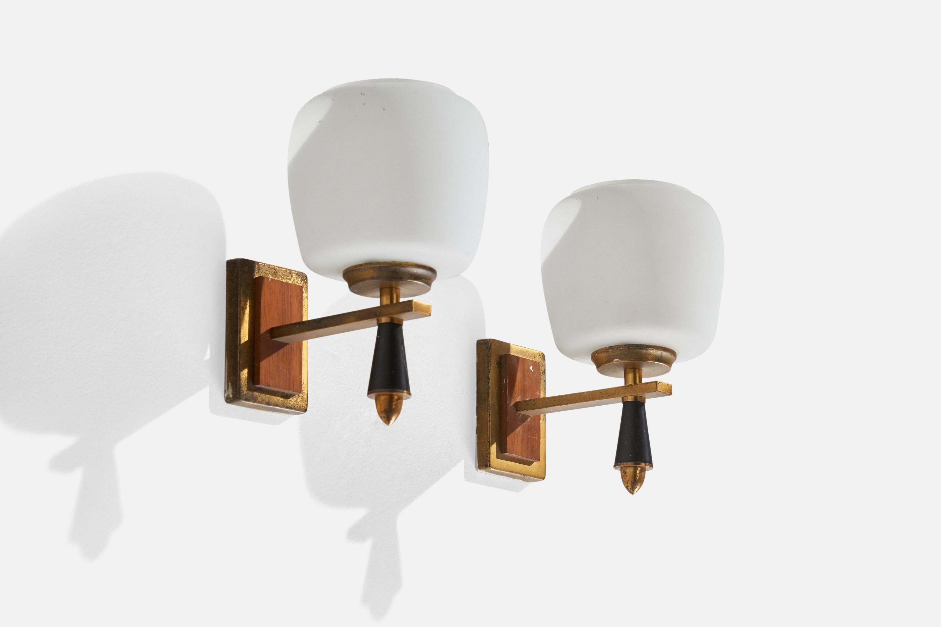A pair of teak, brass, opaline glass and metal wall lights designed and produced in Italy, 1950s.

Overall Dimensions (inches): 8.5” H x 5” W x 7” D
Back Plate Dimensions (inches): 3.75” H x 2.5” W x .50”  D
Bulb Specifications: E-14 Bulb
Number of