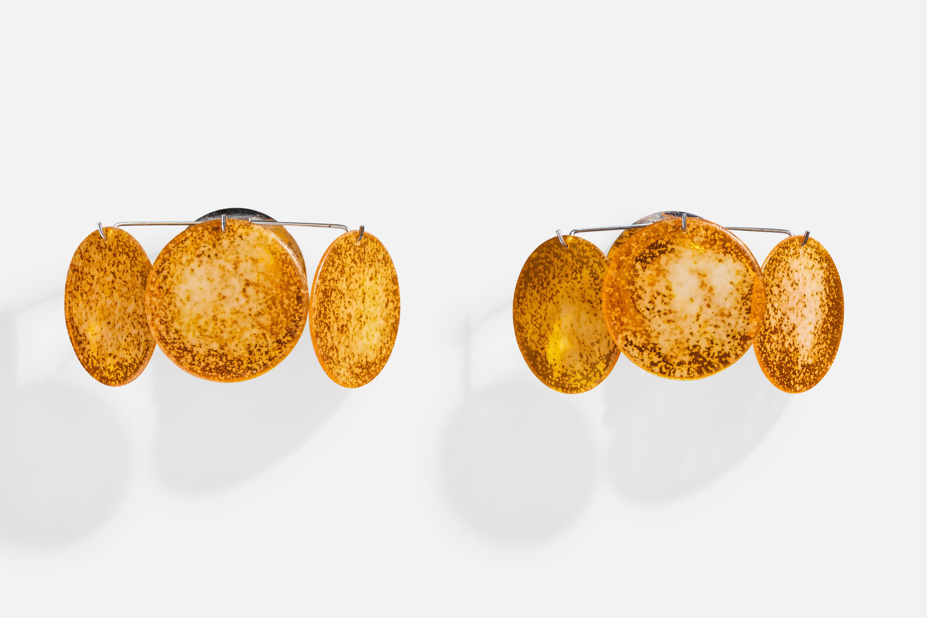 A pair of orange plastic resin and chrome-plated metal wall lights designed and produced in Italy, c. 1970s.

Slight scratches present on acrylic

Overall Dimensions (Inches): 6.5