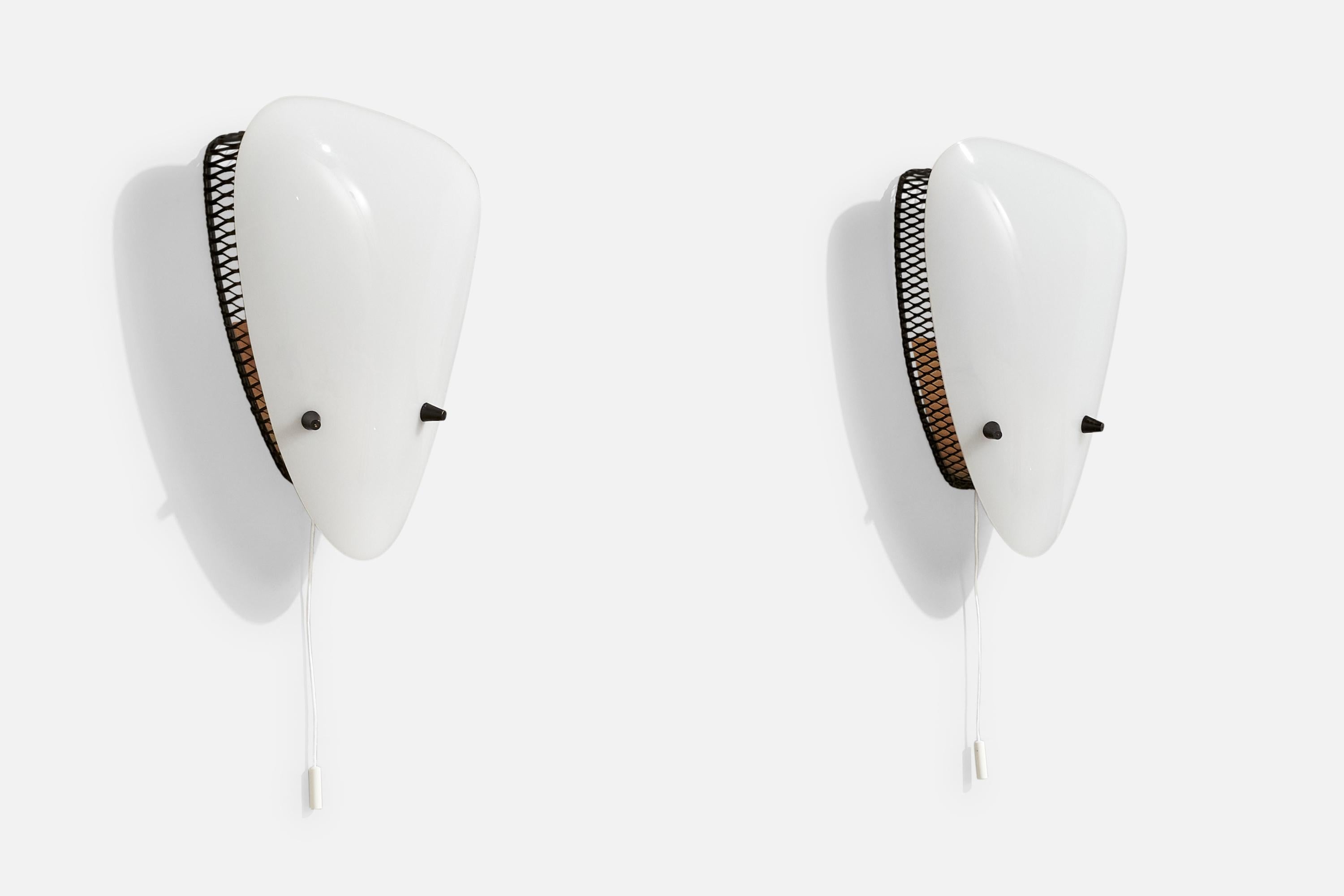 A pair of white acrylic and black-lacquered metal wall lights designed and produced in Italy, c. 1960s.

Overall Dimensions (Inches): 9” H x 6.25” W x 2.5“ D

Back Plate Dimensions (Inches): 4” H x .8” W

Bulb Specifications: E-14

Number of Sockets