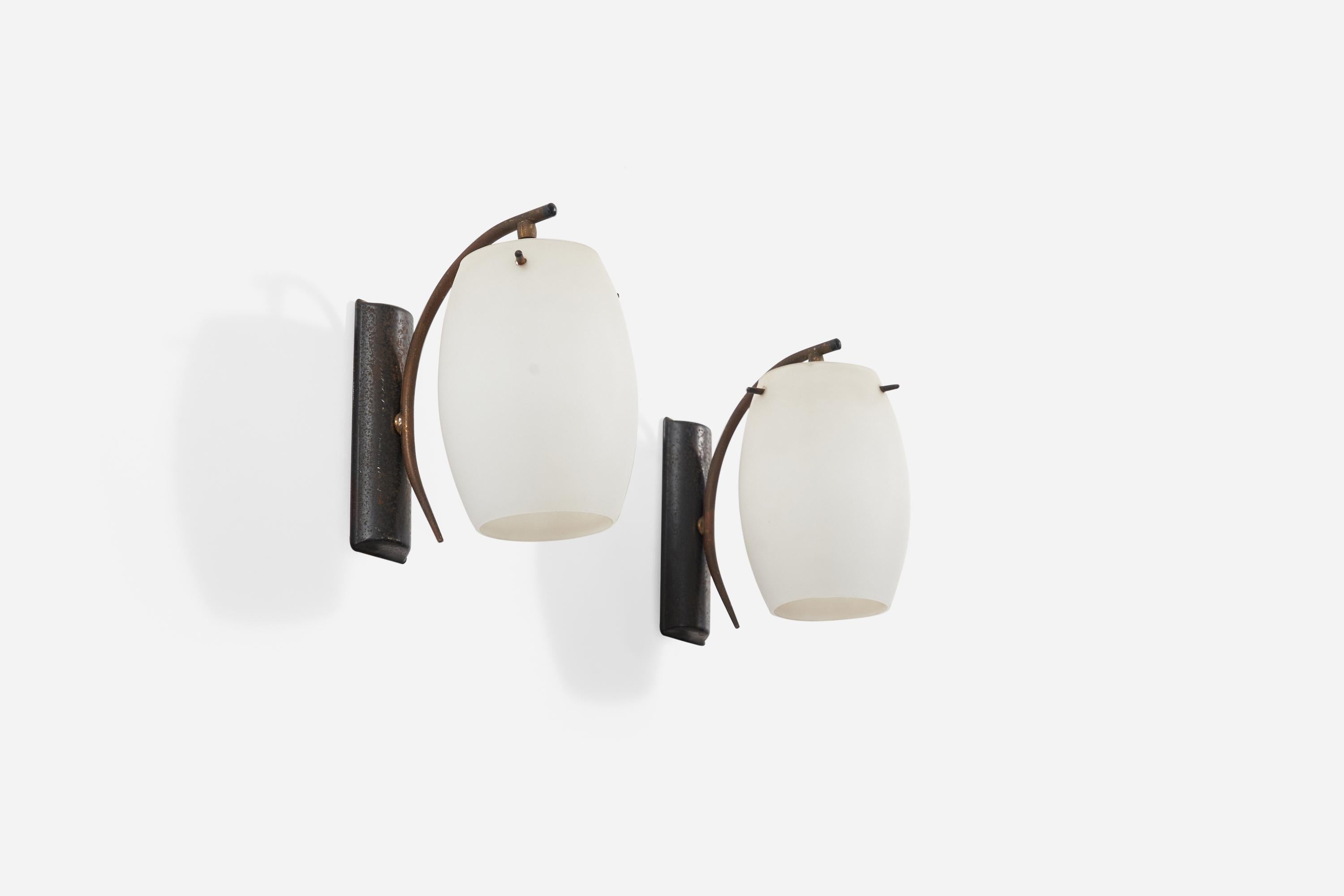 A pair of wall lights in brass, milk glass, and black-lacquered metal designed and produced in Italy, 1950s.