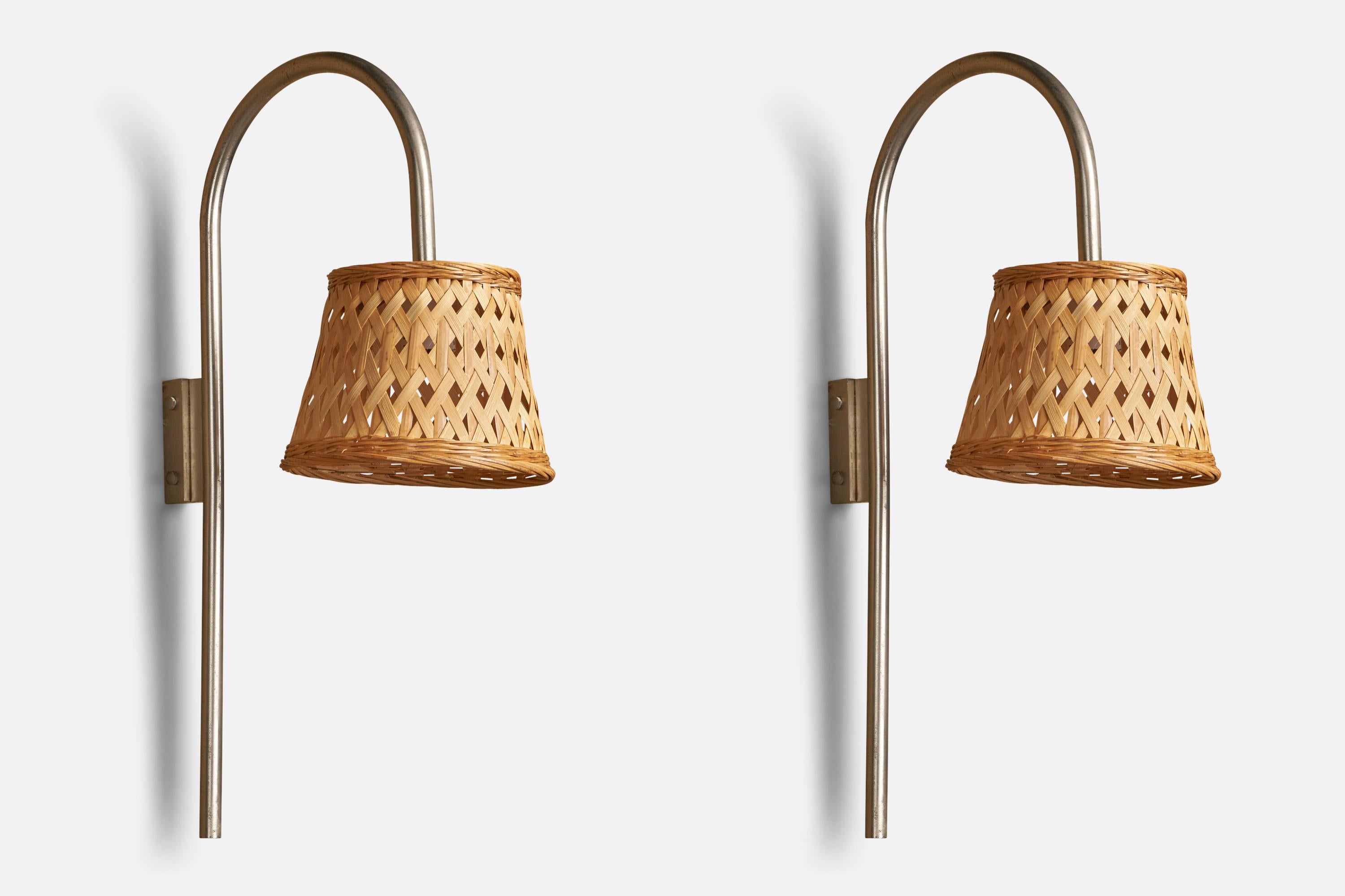 A pair of nickel and rattan wall lights, designed and produced in Italy, c. 1960s.

Overall Dimensions (inches): 24