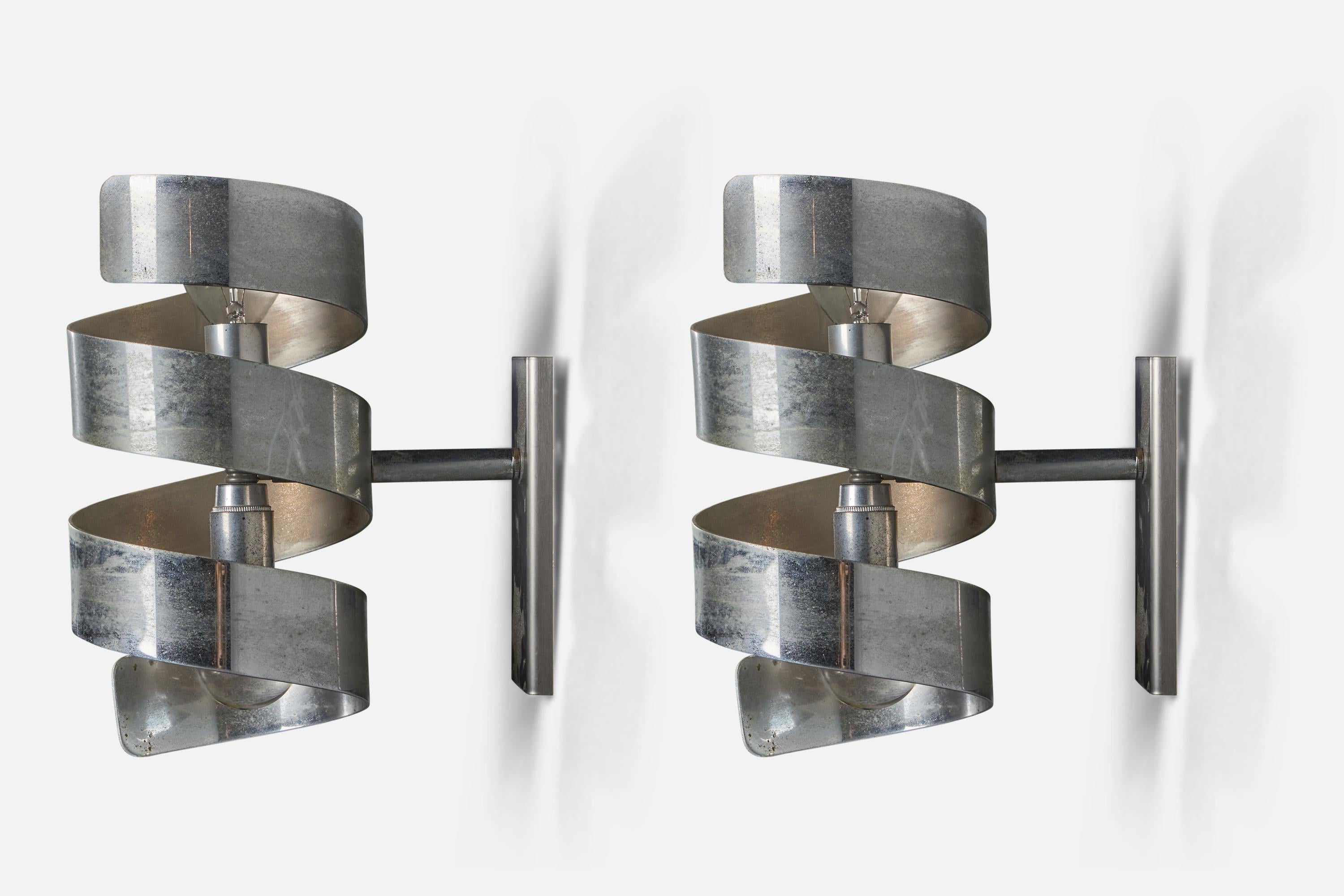 A pair of steel wall lights, designed and produced in Italy, 1960s.

Overall Dimensions (inches): 9.75