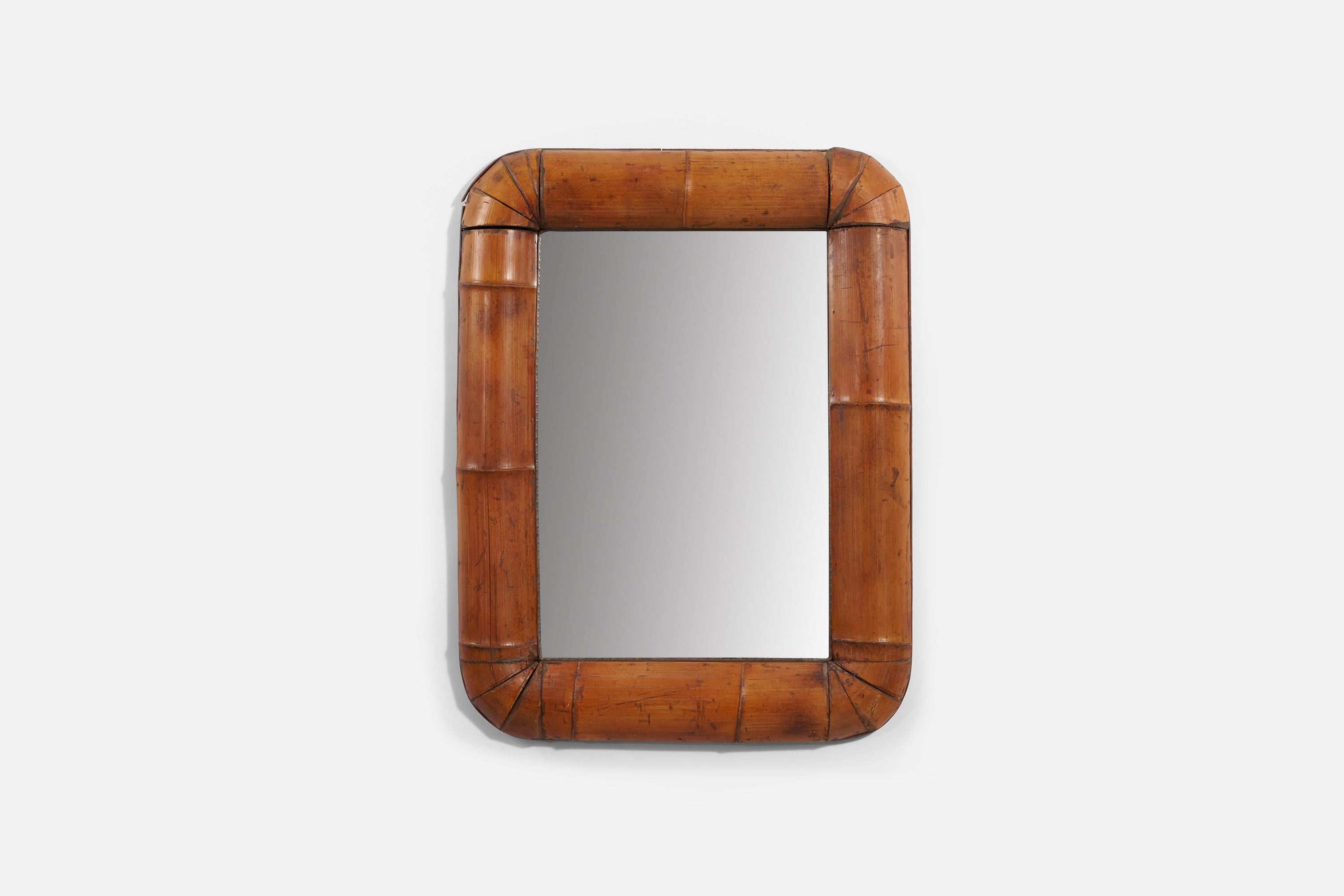 A bamboo wall mirror produced in Italy, 1950s.
 