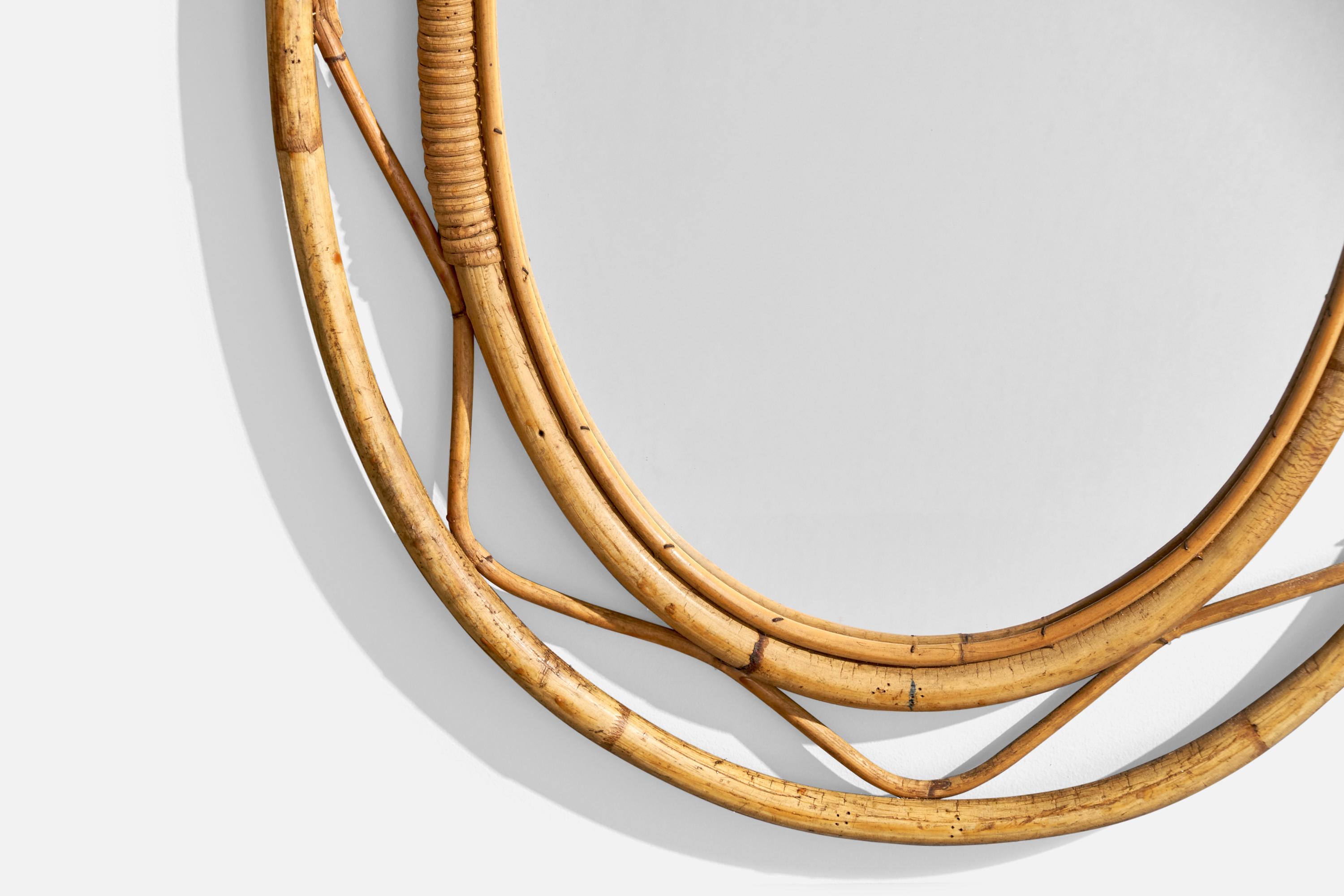 A bamboo wall mirror designed and produced in Italy, c. 1960s.

Mirror Dimensions (inches): 29.75