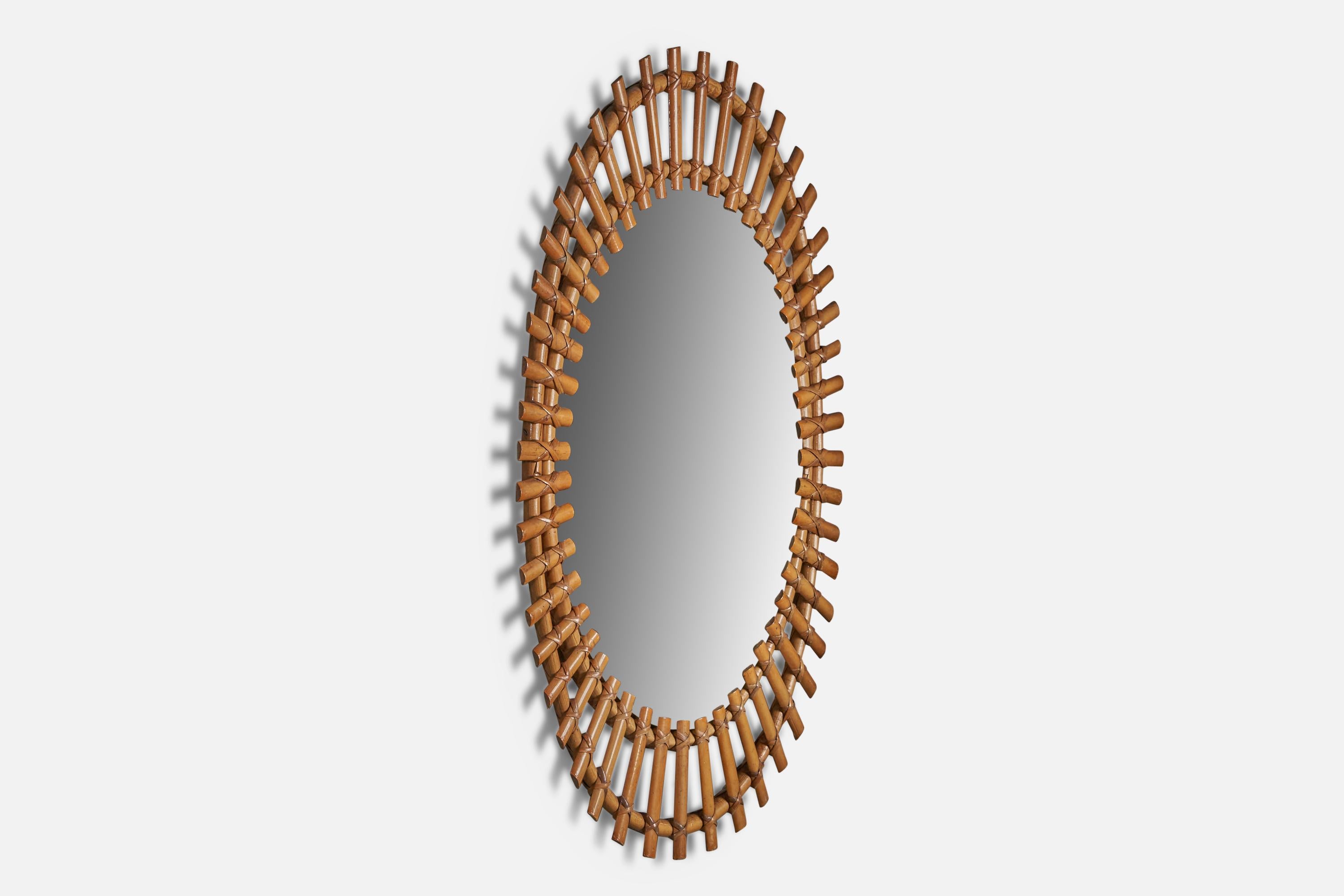 A bamboo and rattan wall mirror, designed and produced in Italy, 1950s.
