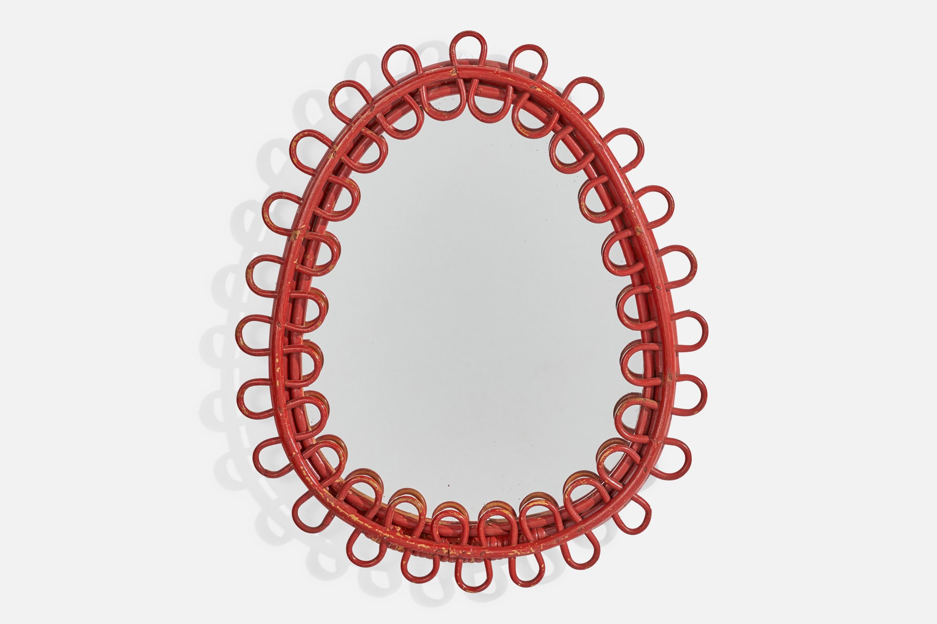 A red-painted rattan and bamboo wall mirror designed and produced in Italy, c. 1960s.