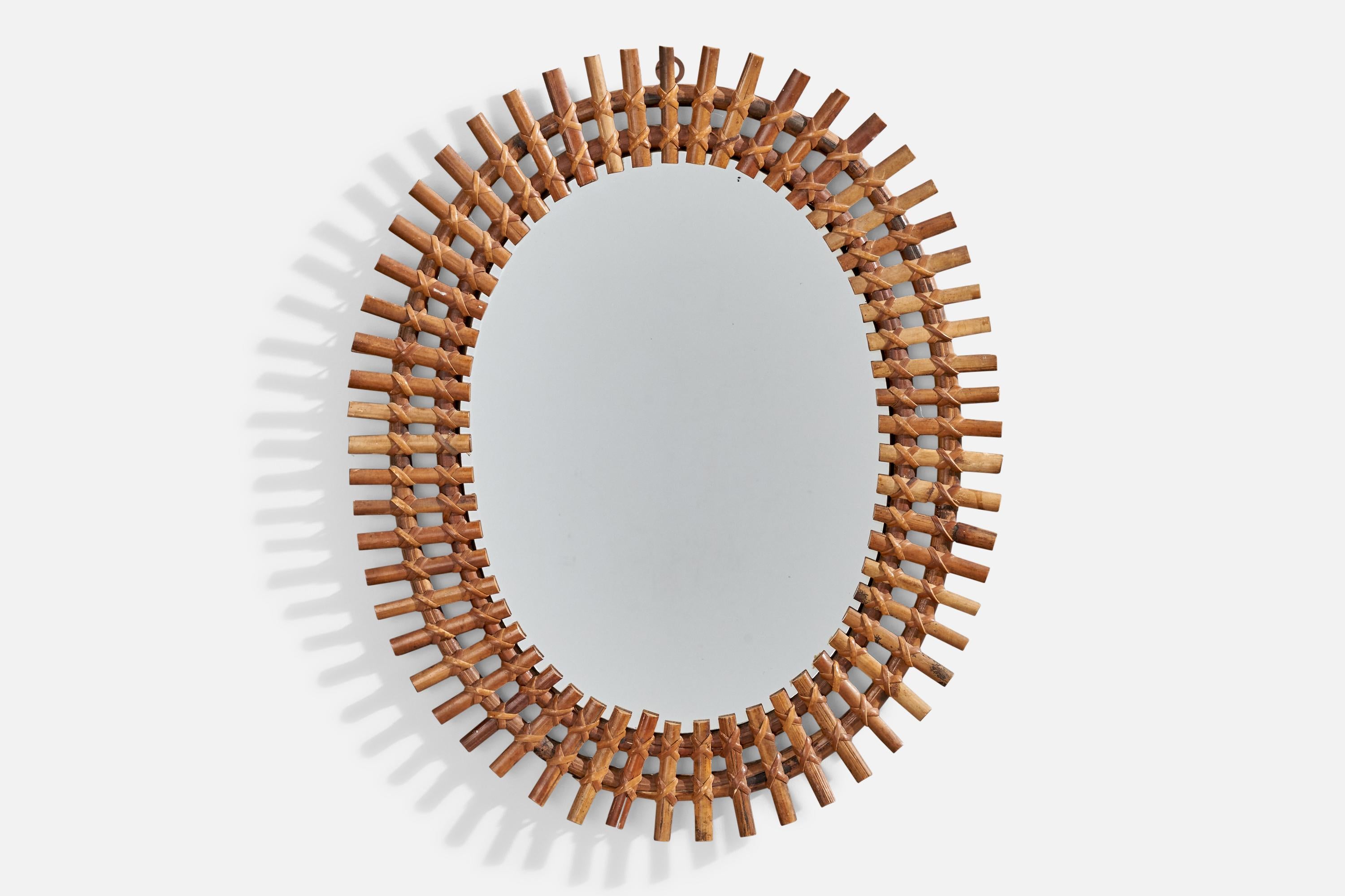 A bamboo and rattan wall mirror designed and produced in Italy, 1960s.