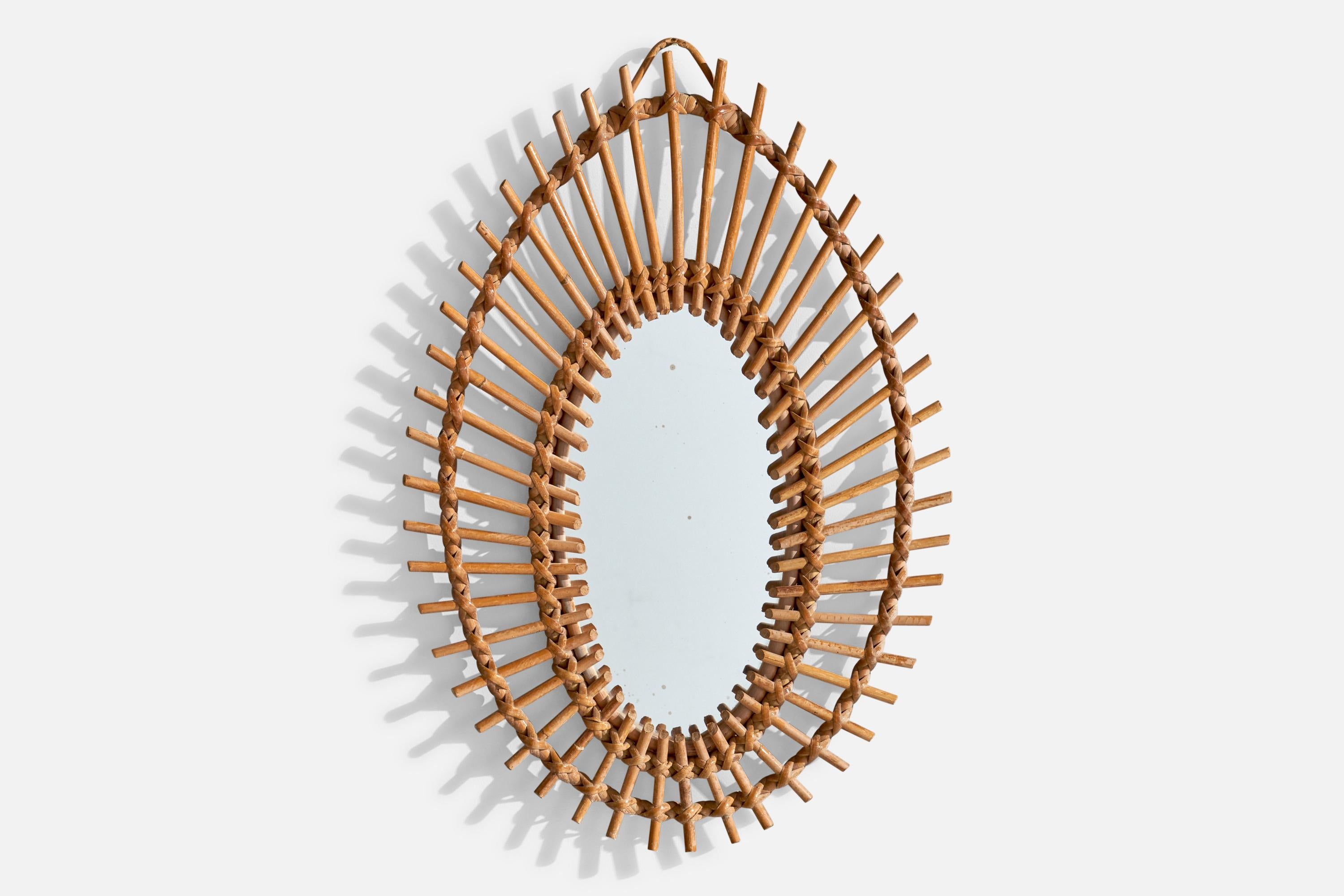 Espejo de pared de bambú y ratán diseñado y fabricado en Italia, c. 1960.

Dimensiones del espejo (pulgadas): 24,625 