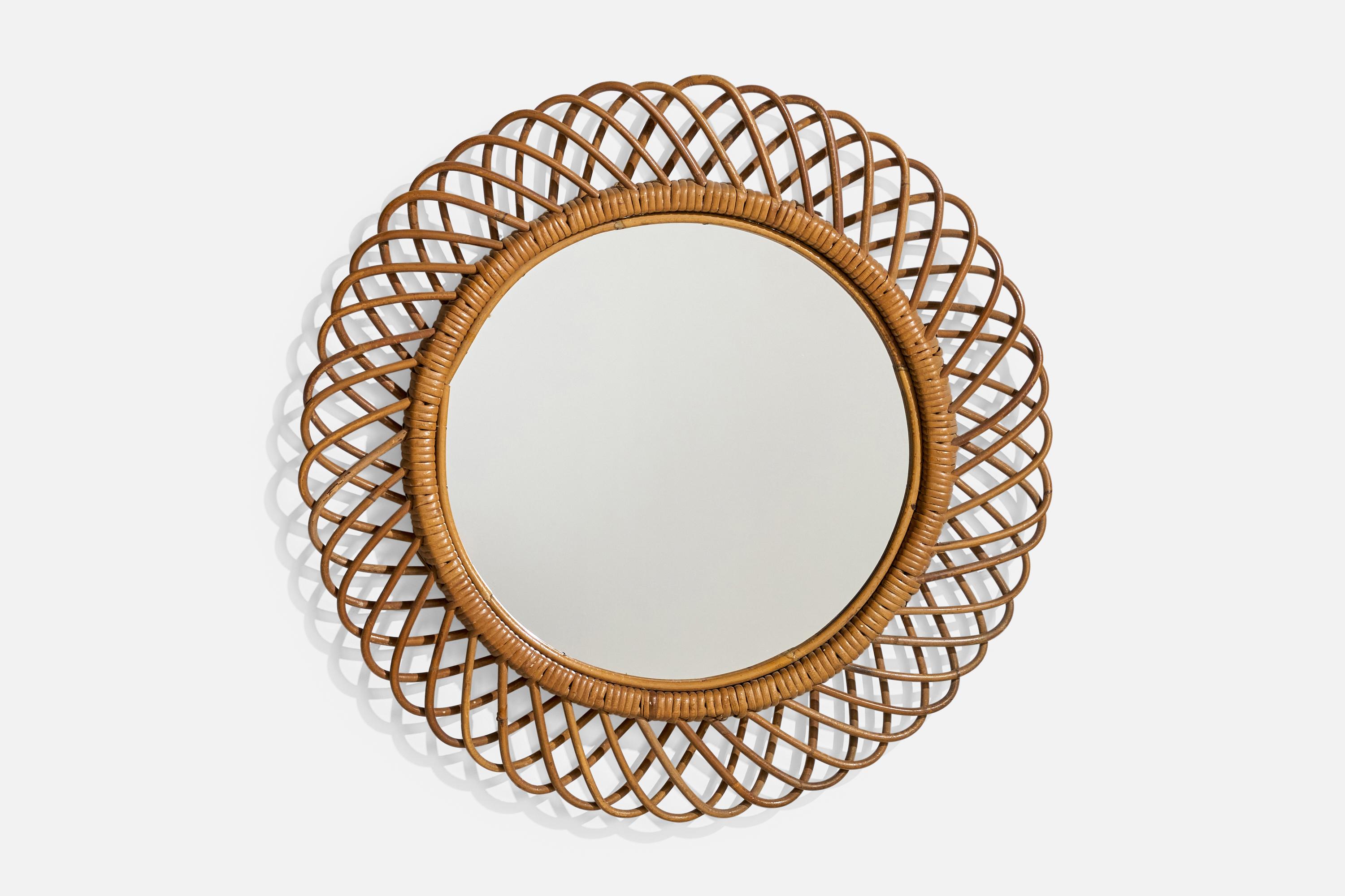 Miroir mural en bambou et rotin, conçu et produit en Italie, C.C., années 1960.

Dimensions (pouces) : 24 Diamètre x 2
