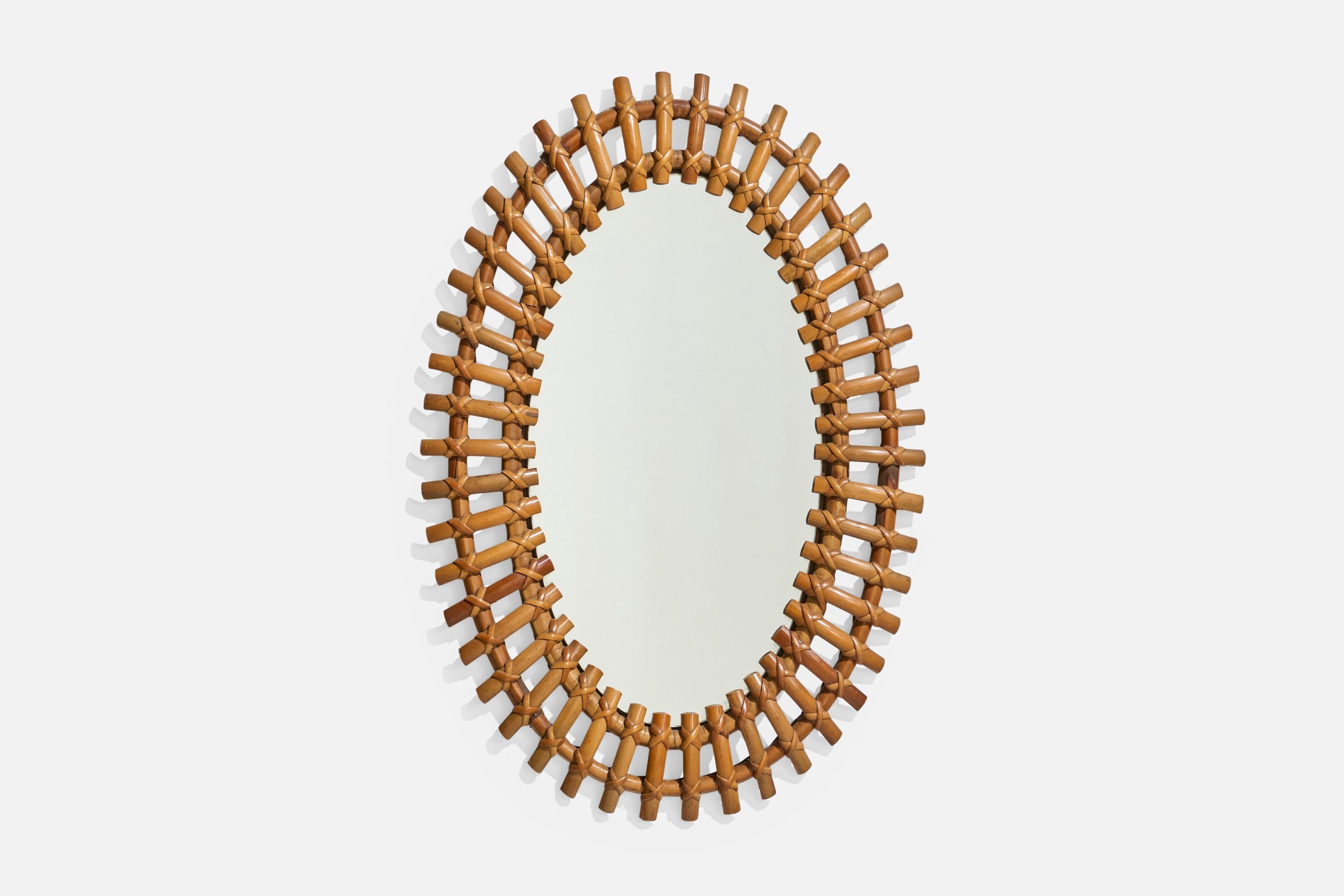 Miroir mural en bambou et rotin, conçu et produit en Italie, C.C., années 1960.

Dimensions : 26,5