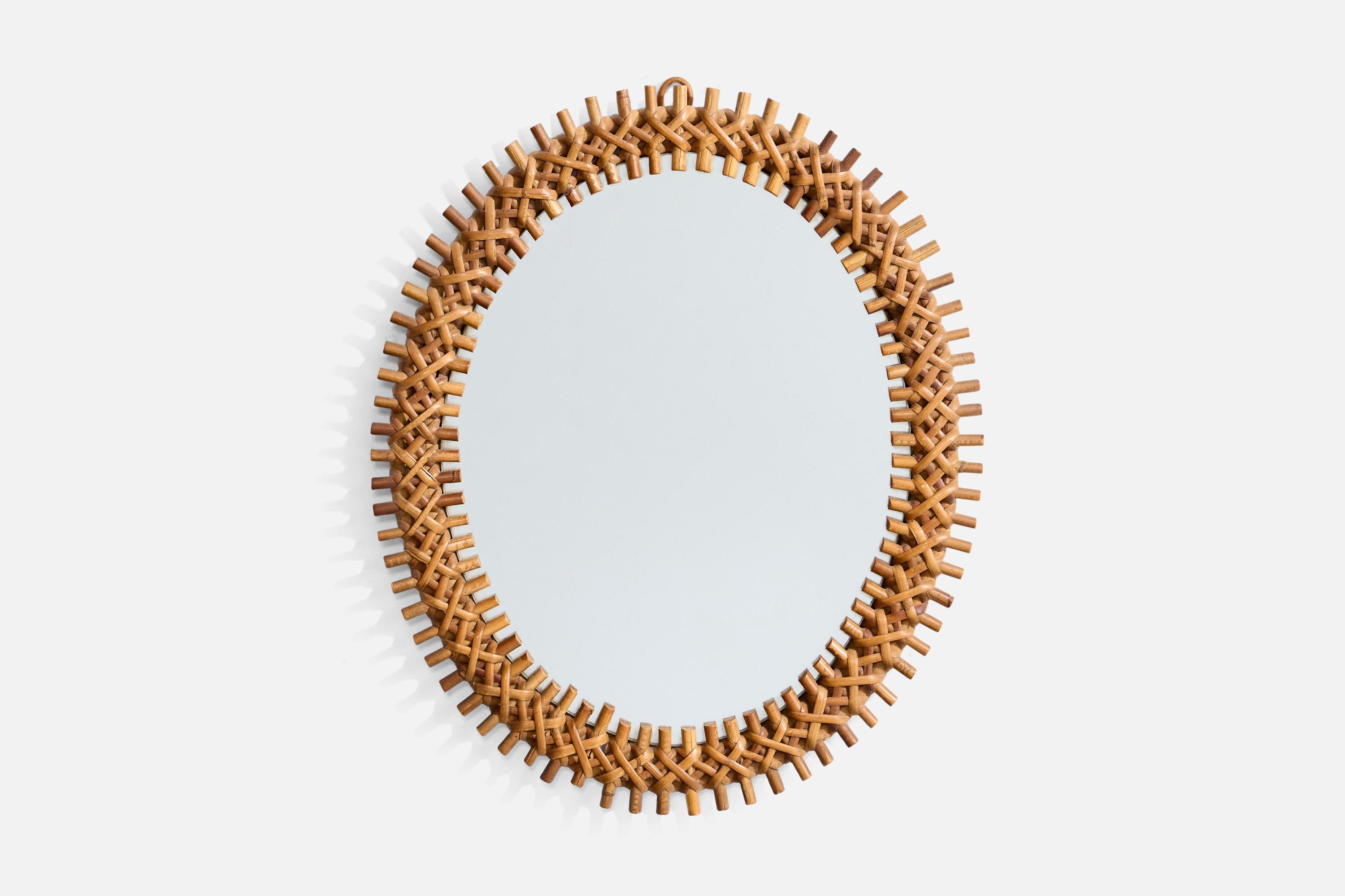Specchio da parete in bambù e rattan progettato e prodotto in Italia, anni '60 circa.

Dimensioni: 20,6