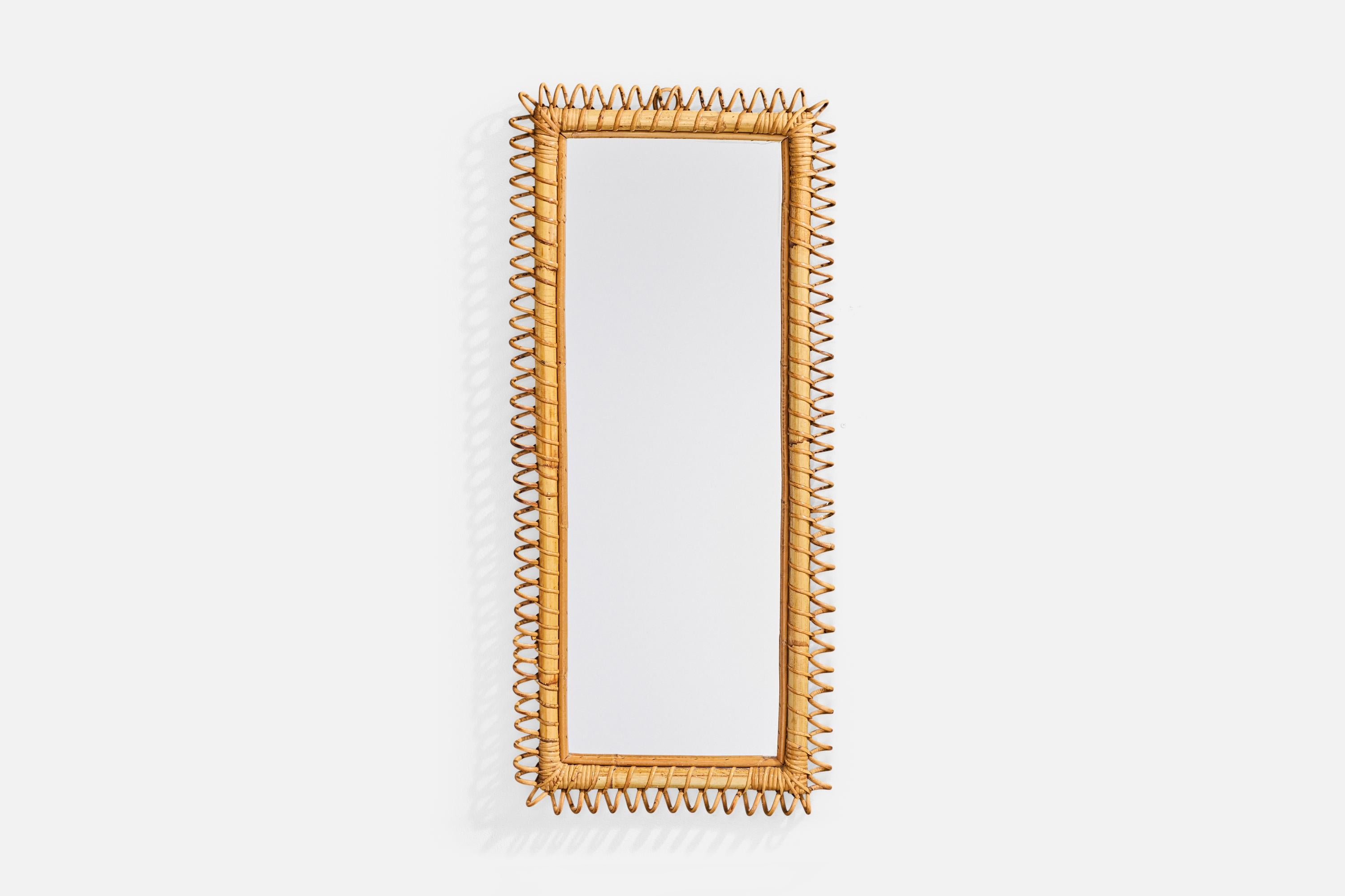 A bamboo and rattan wall mirror designed and produced in Italy, c. 1960s.

Overall Dimensions (inches): 35.8