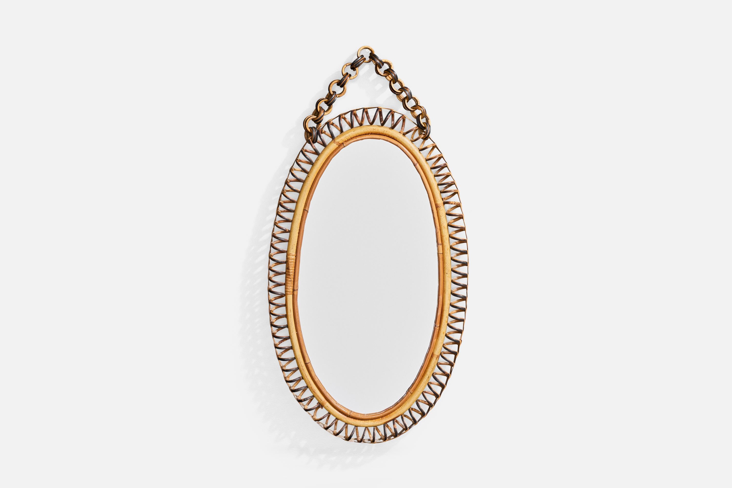 A bamboo and rattan wall mirror designed and produced in Italy, c. 1960s.

Overall Dimensions (inches): 27.5