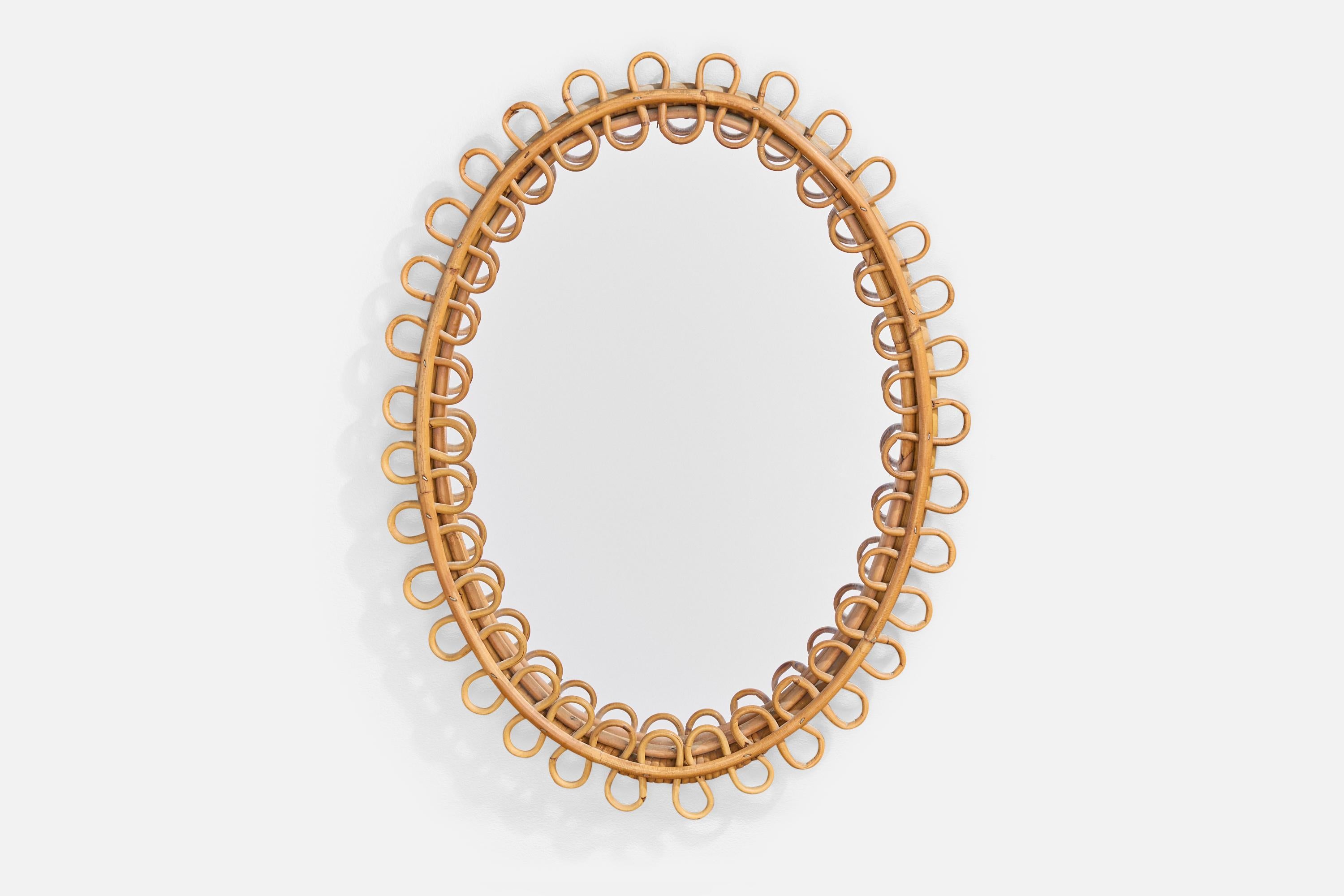 Specchio da parete in bambù e rattan progettato e prodotto in Italia, anni '60 circa.

Dimensioni complessive (pollici): 23.0 