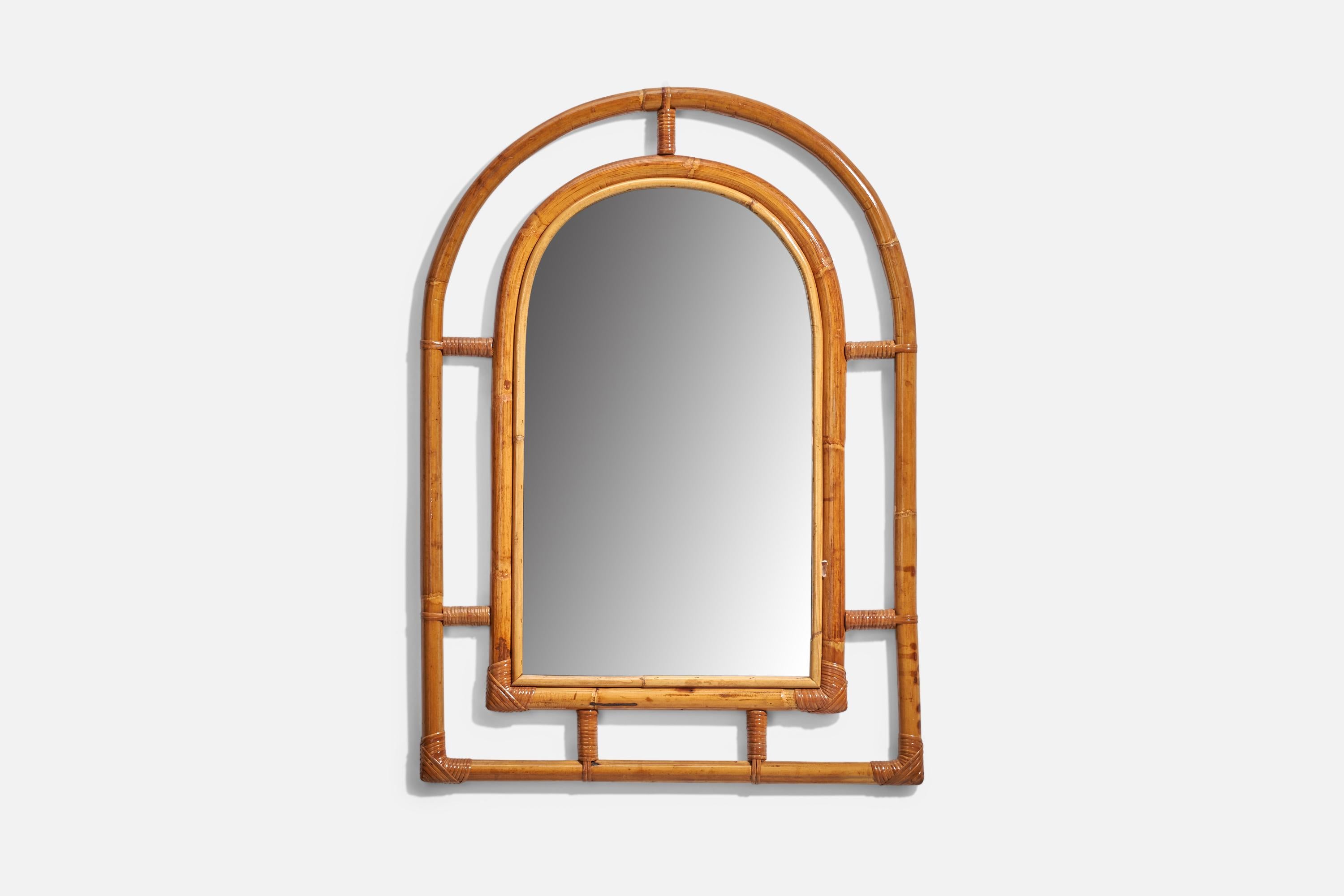 A bamboo and rattan wall mirror produced and designed in Italy, 1960s.