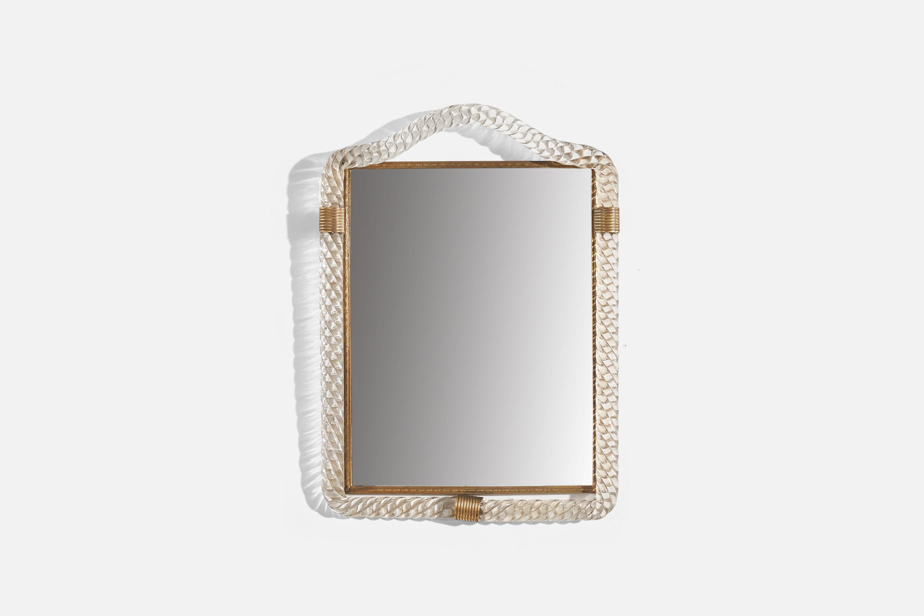A brass and glass wall mirror designed and produced in Italy, c. 1950s.
 