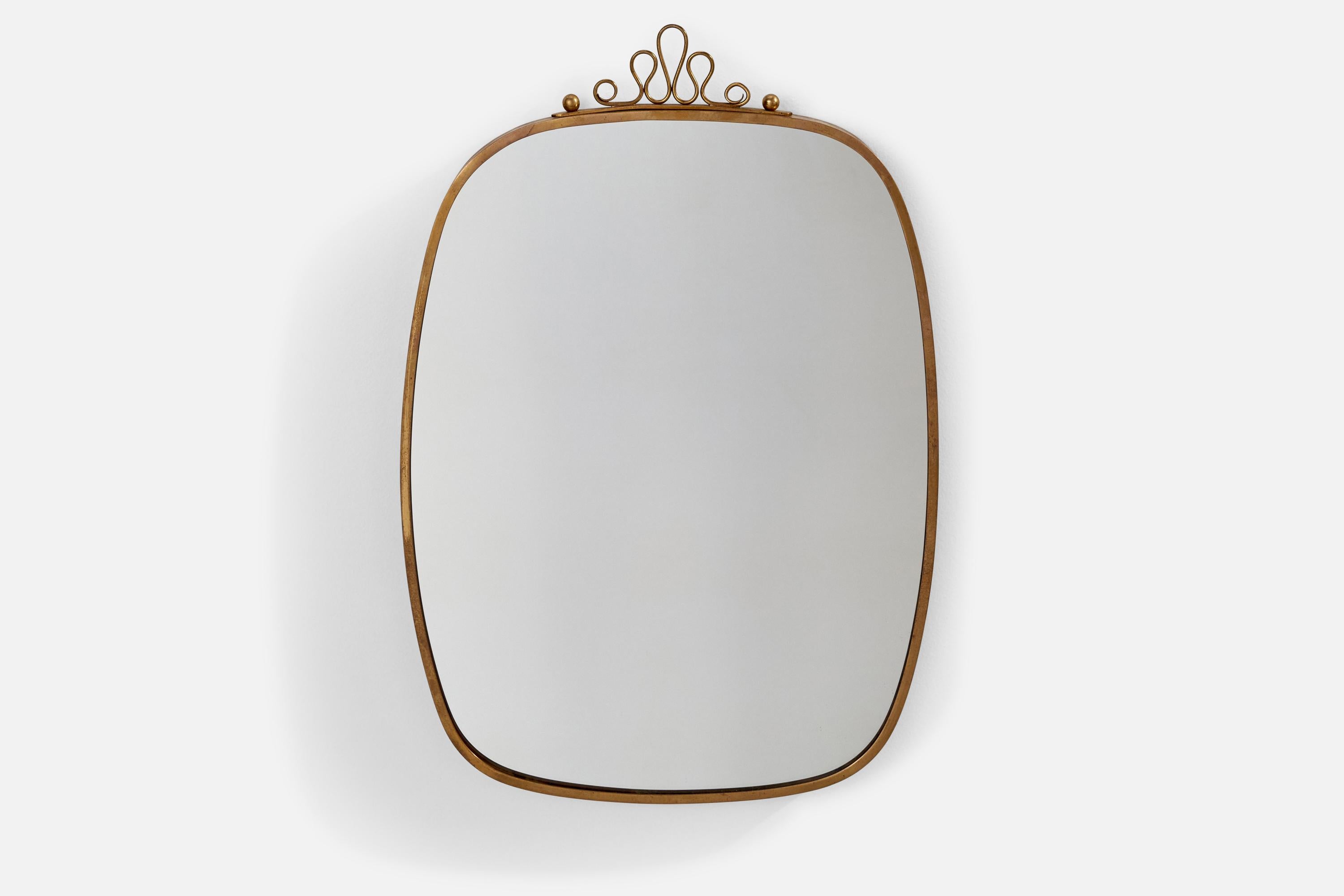 A brass wall mirror designed and produced in Italy, 1940s.