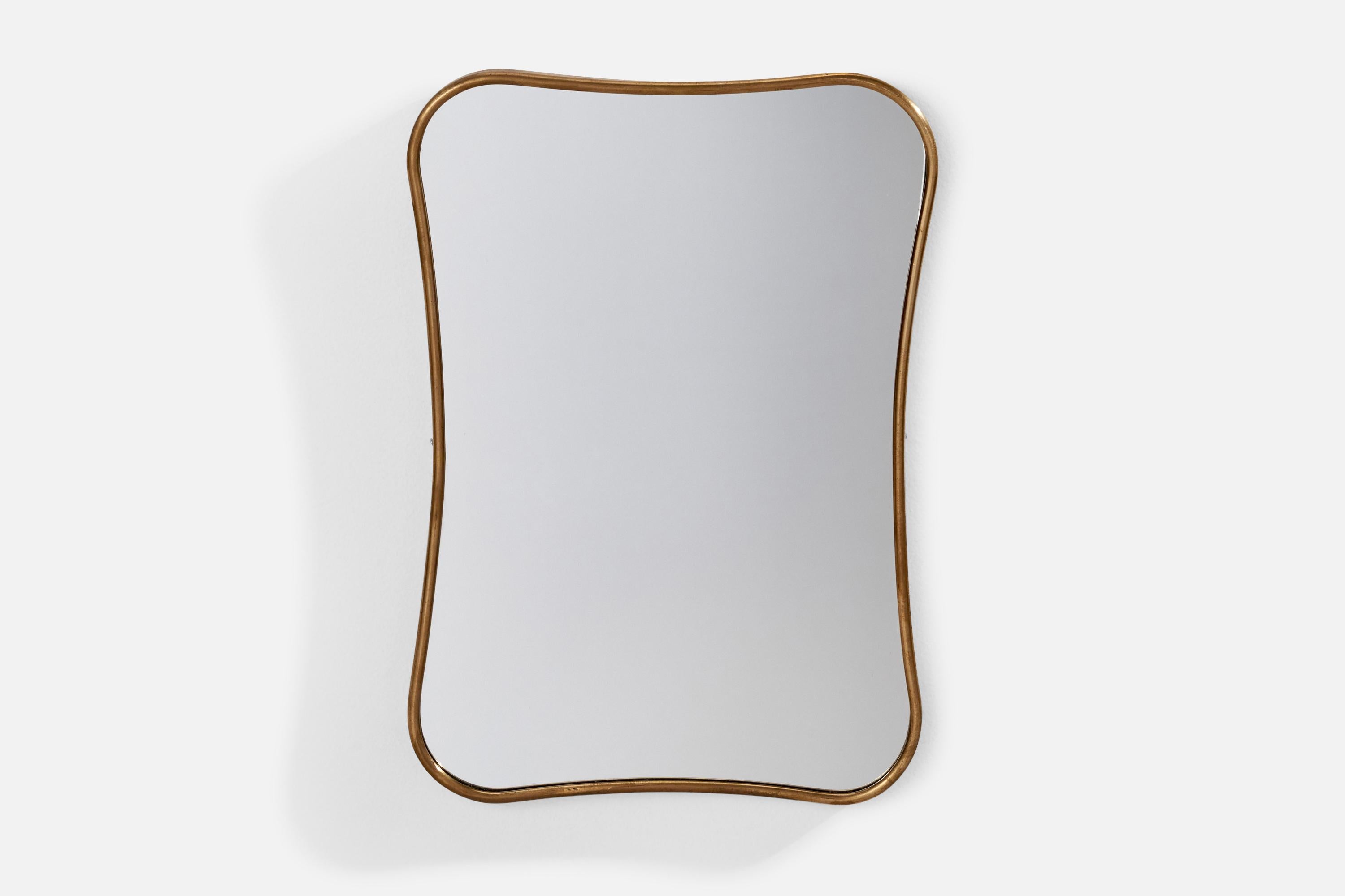A brass wall mirror designed and produced in Italy, 1940s.