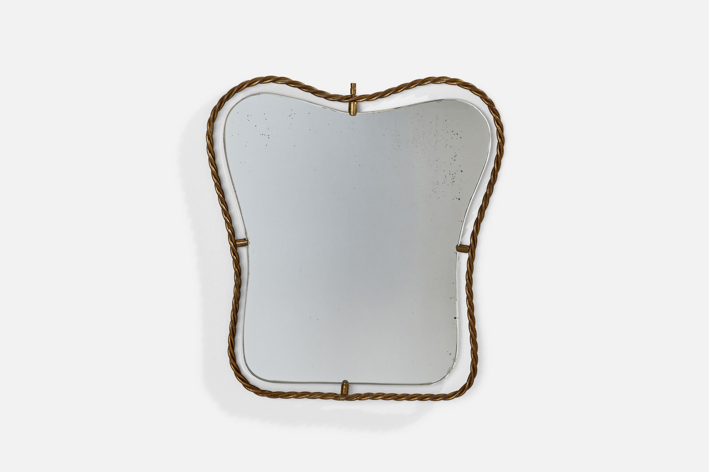A brass wall mirror designed and produced in Italy, 1940s.