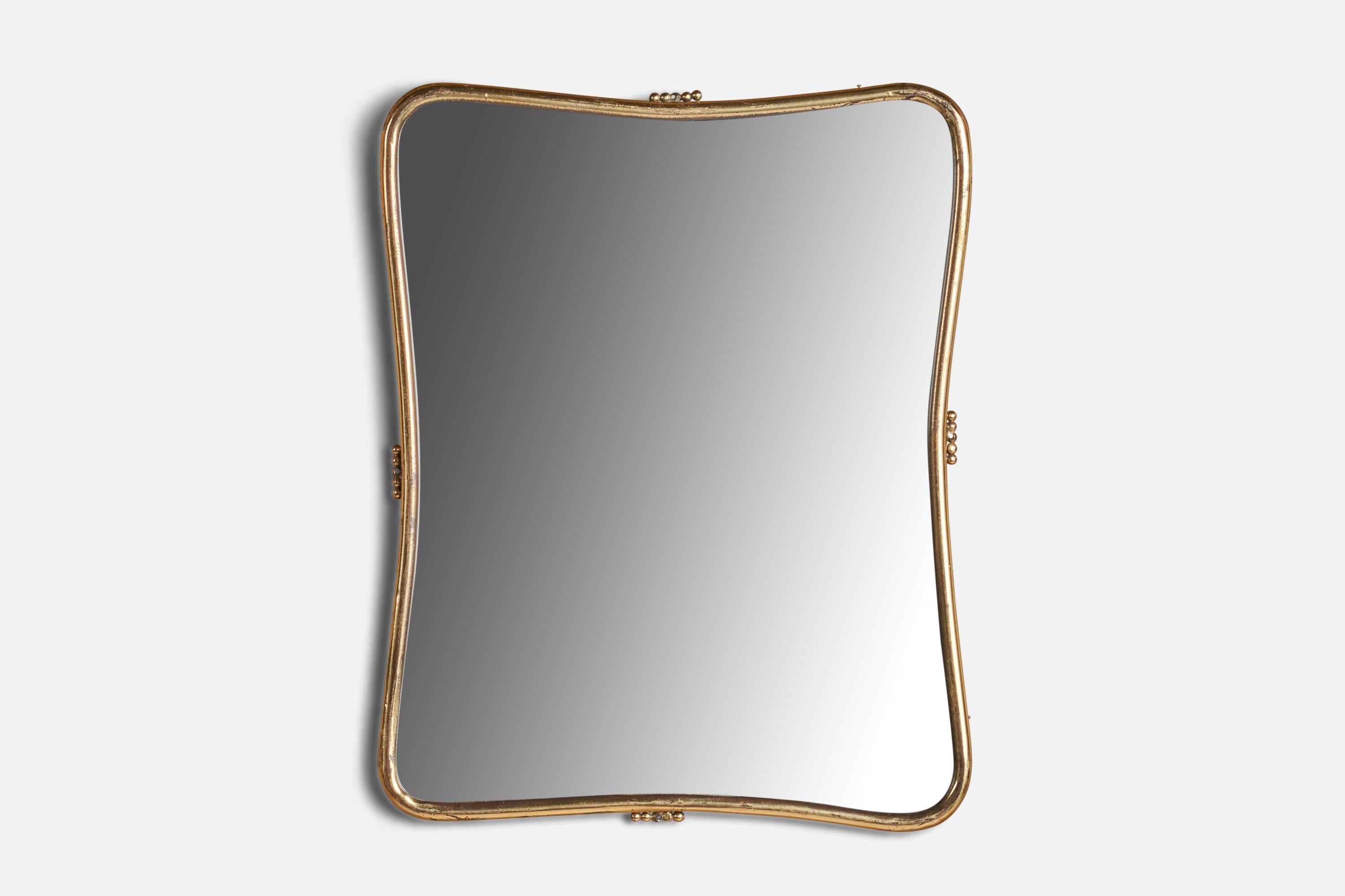 A brass wall mirror designed and produced in Italy, 1940s.
