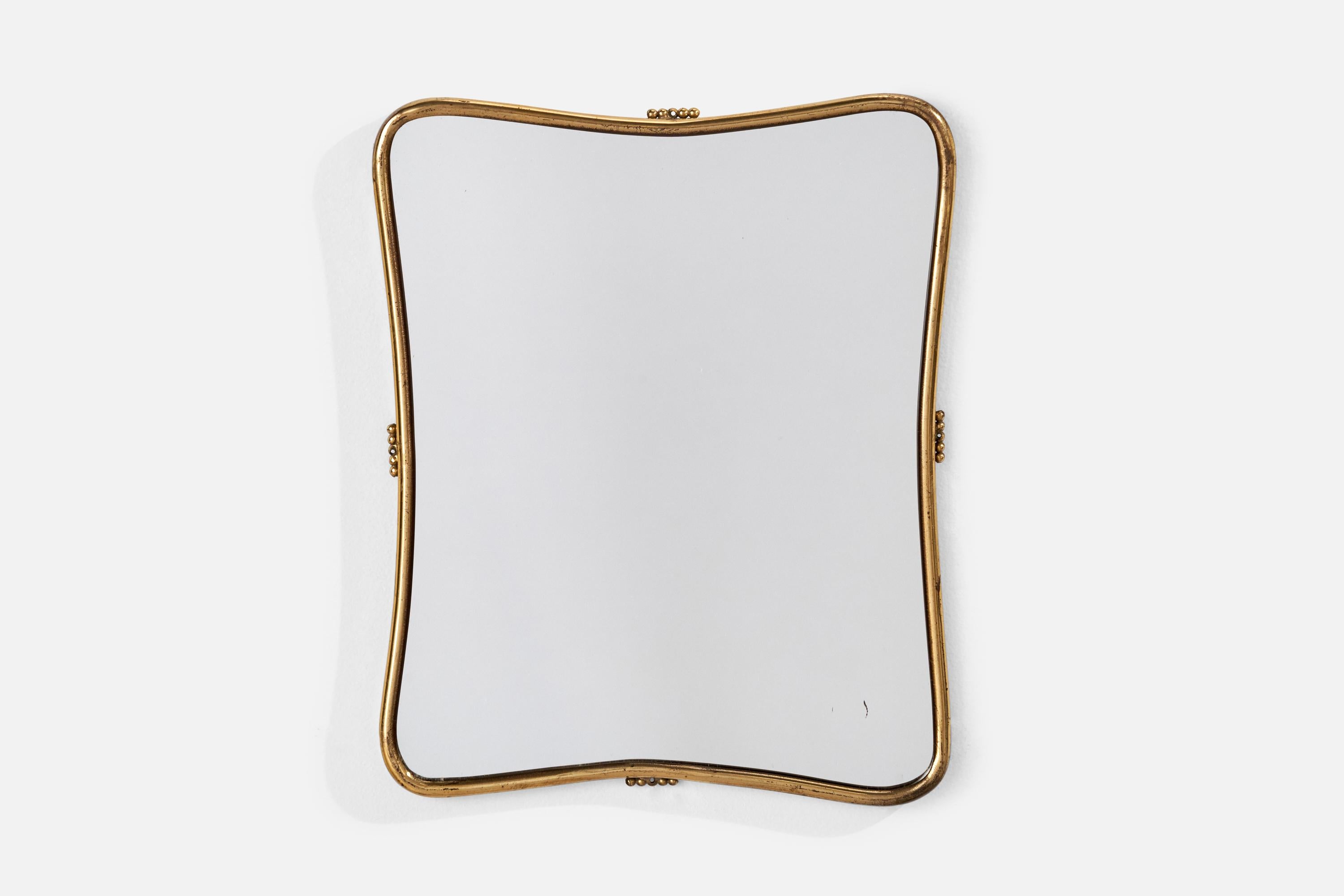 A brass wall mirror designed and produced in Italy, 1940s.