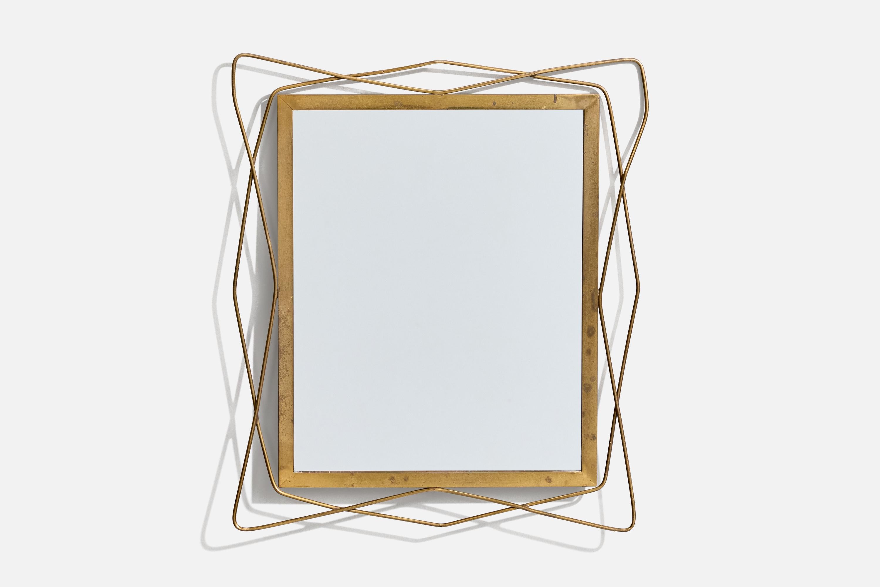 A brass wall mirror designed and produced in Italy, 1940s.