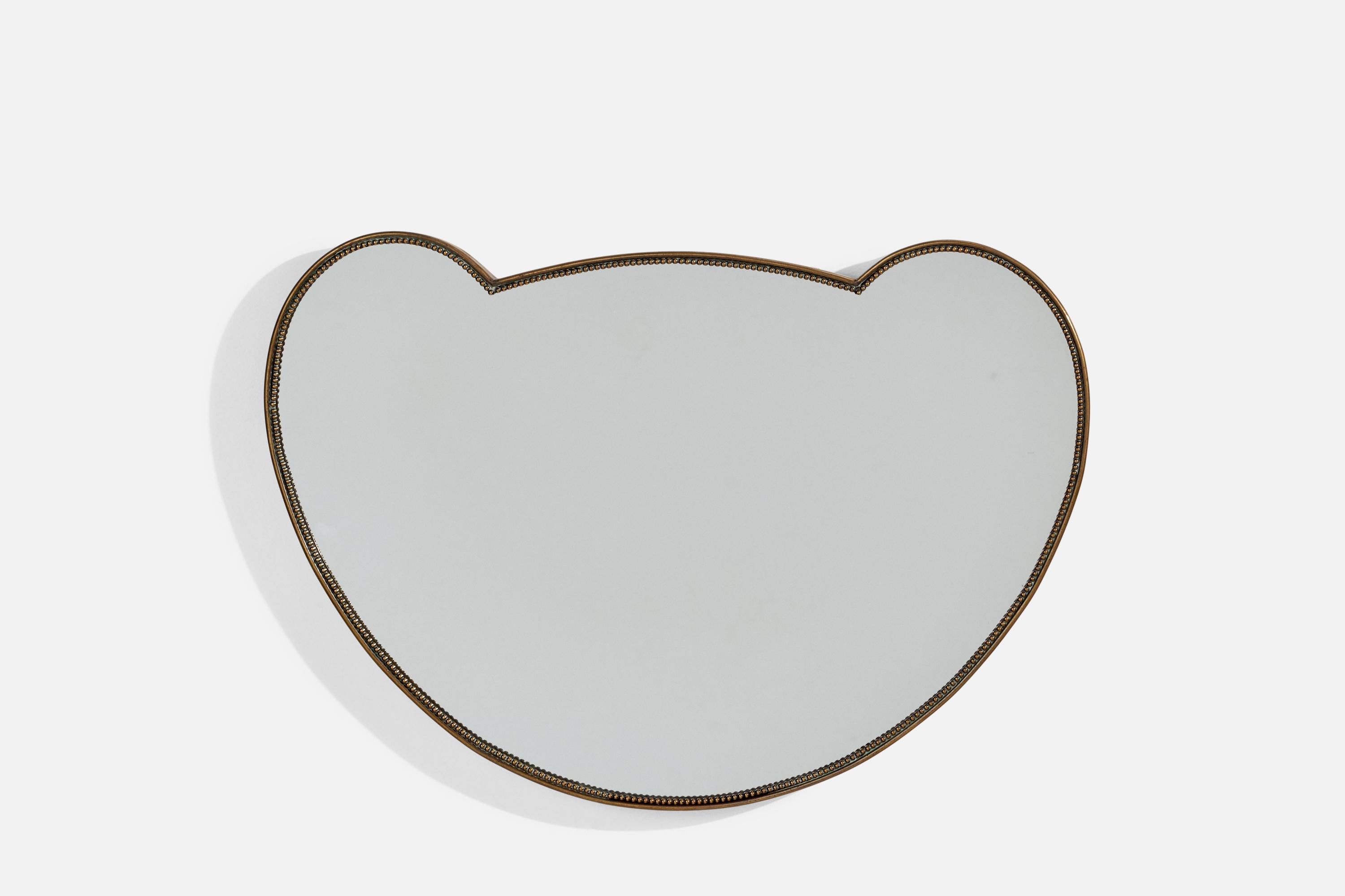 A brass wall mirror produced in Italy, 1940s. 
 