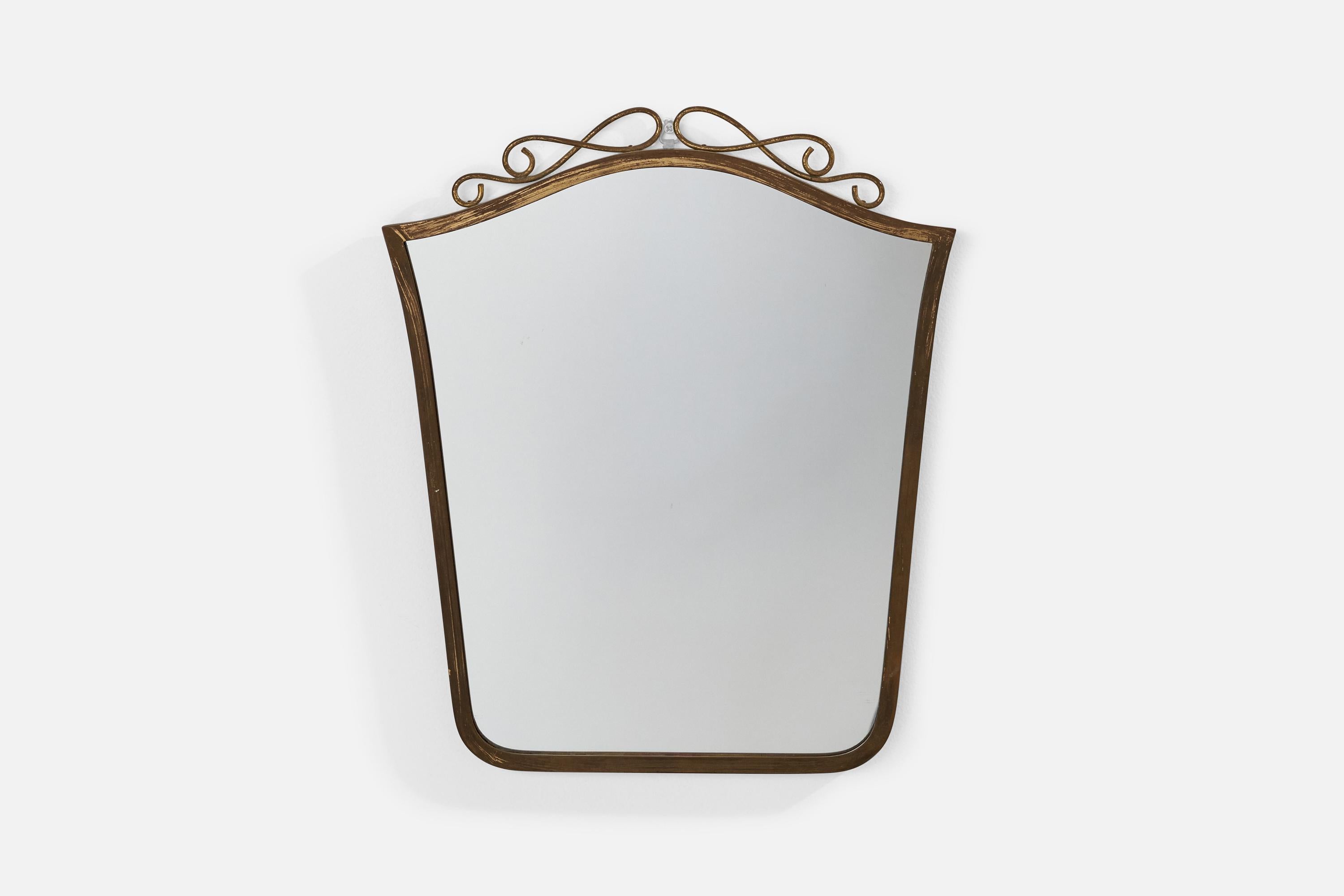 A brass wall mirror designed and produced in Italy, 1940s.