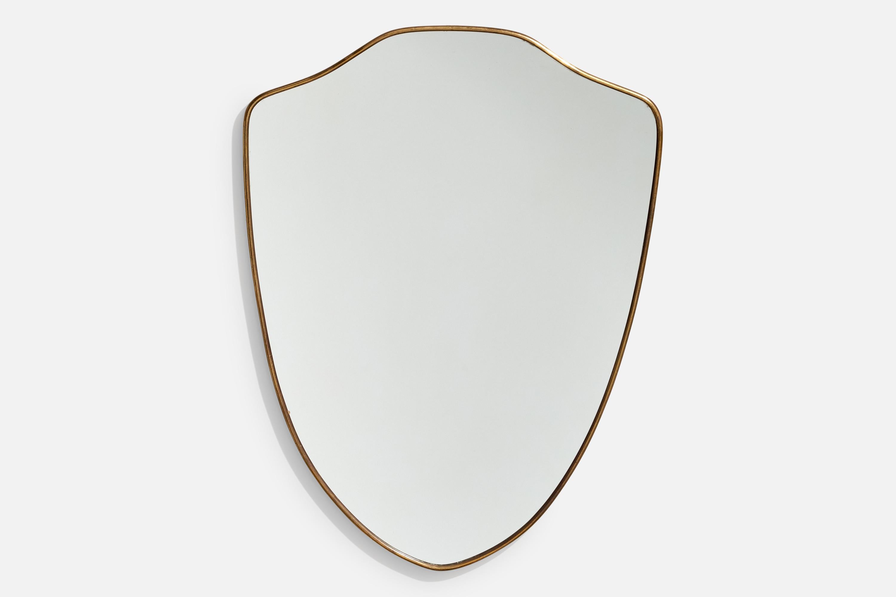 A brass wall mirror designed and produced in Italy, 1950s. 