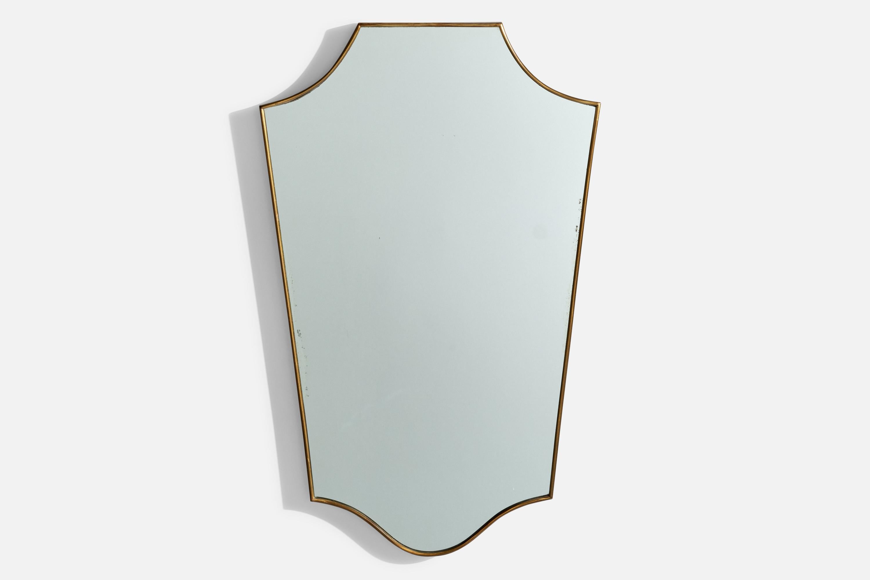 A brass wall mirror designed and produced in Italy, 1950s. 