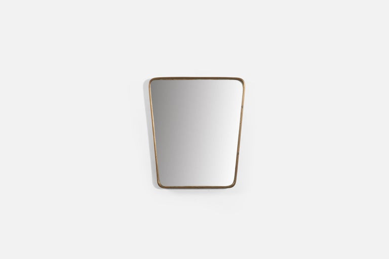 A brass wall mirror produced in Italy, 1950s.
 