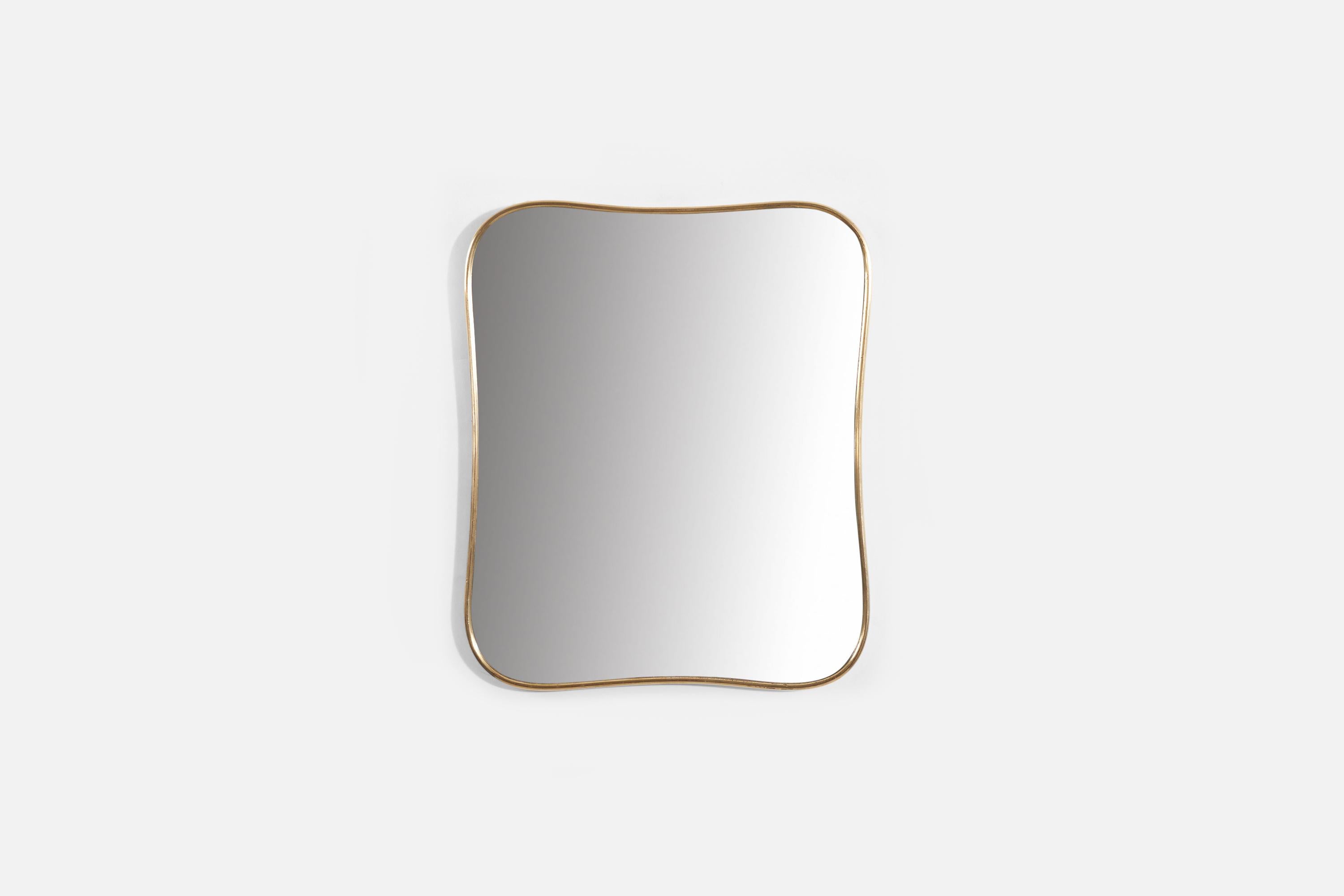 A brass wall mirror produced in Italy, 1950s.
 
