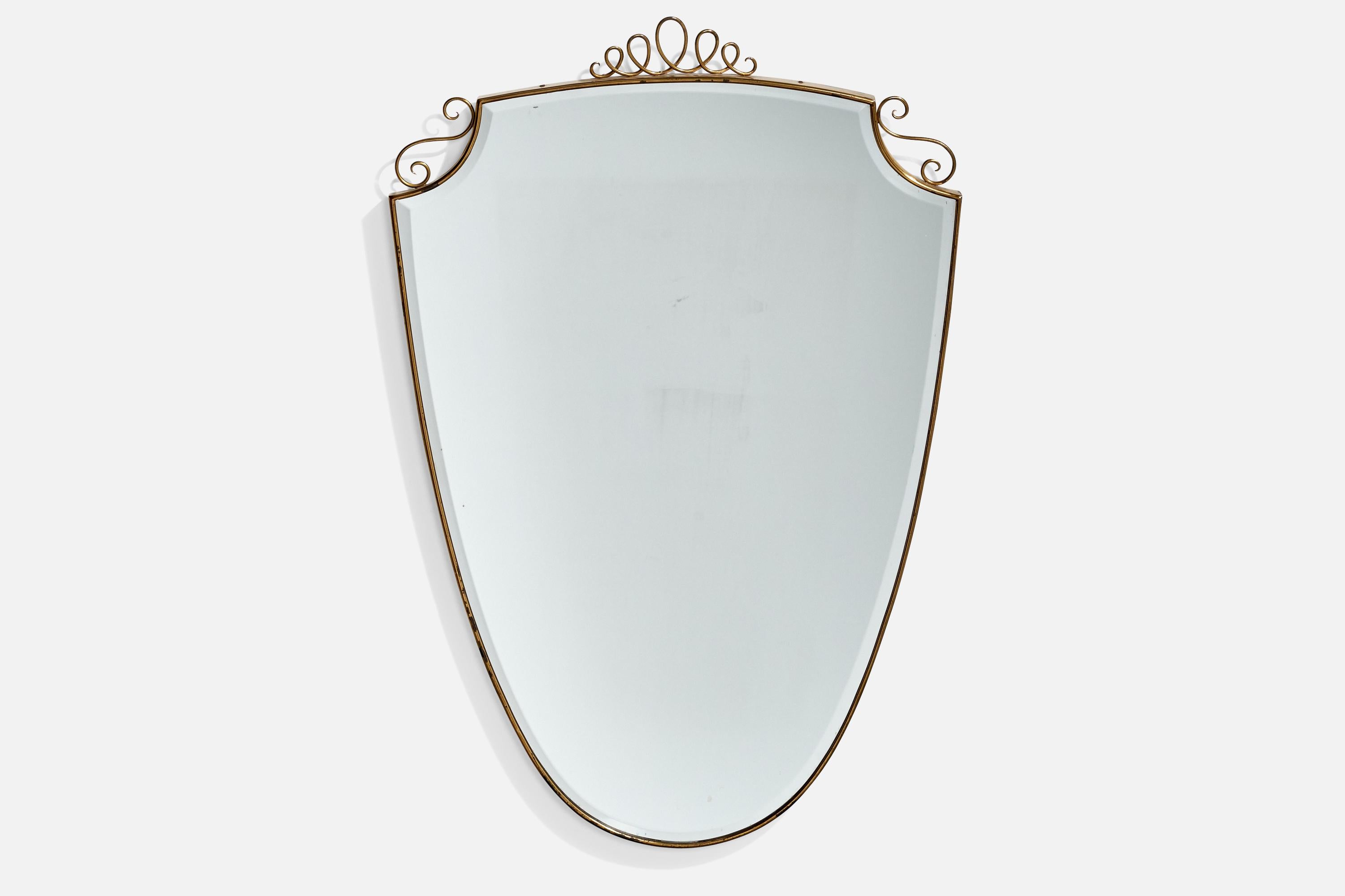 A brass wall mirror designed and produced in Italy, c. 1940s.
 