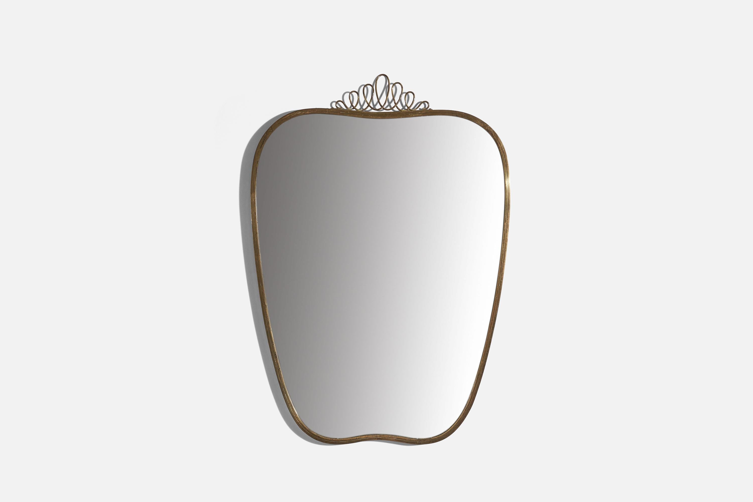 A brass wall mirror designed and produced in Italy, c. 1940s.
 