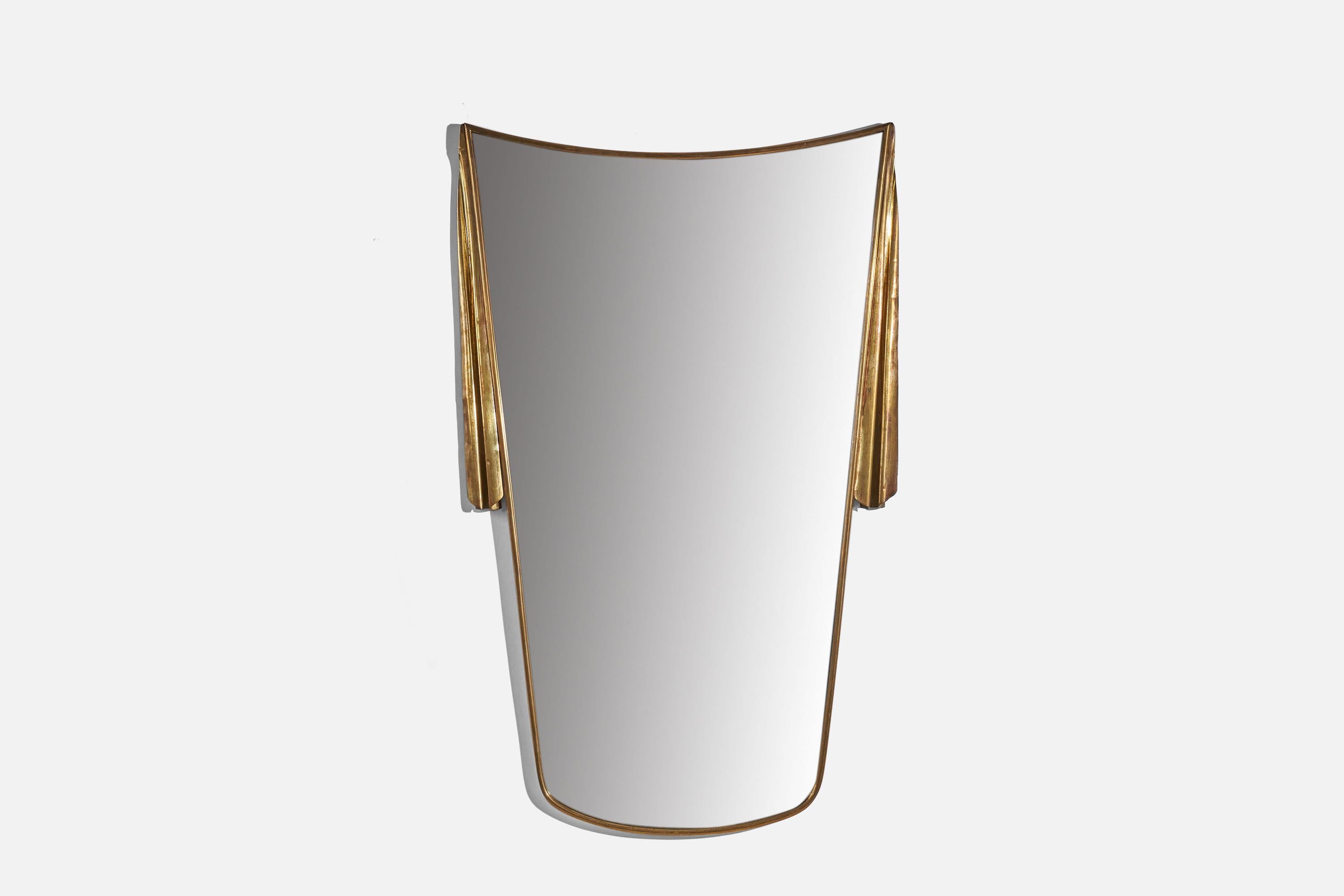 A brass wall mirror designed and produced in Italy, c. 1940s.
 