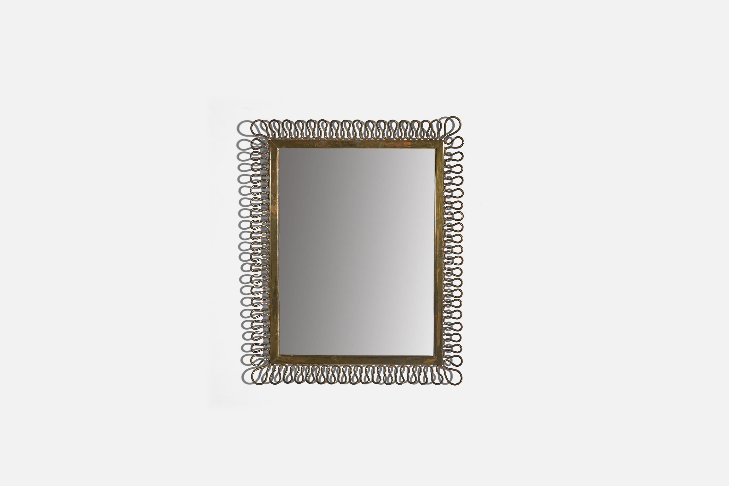 A brass wall mirror designed and produced in Italy, c. 1940s.
 