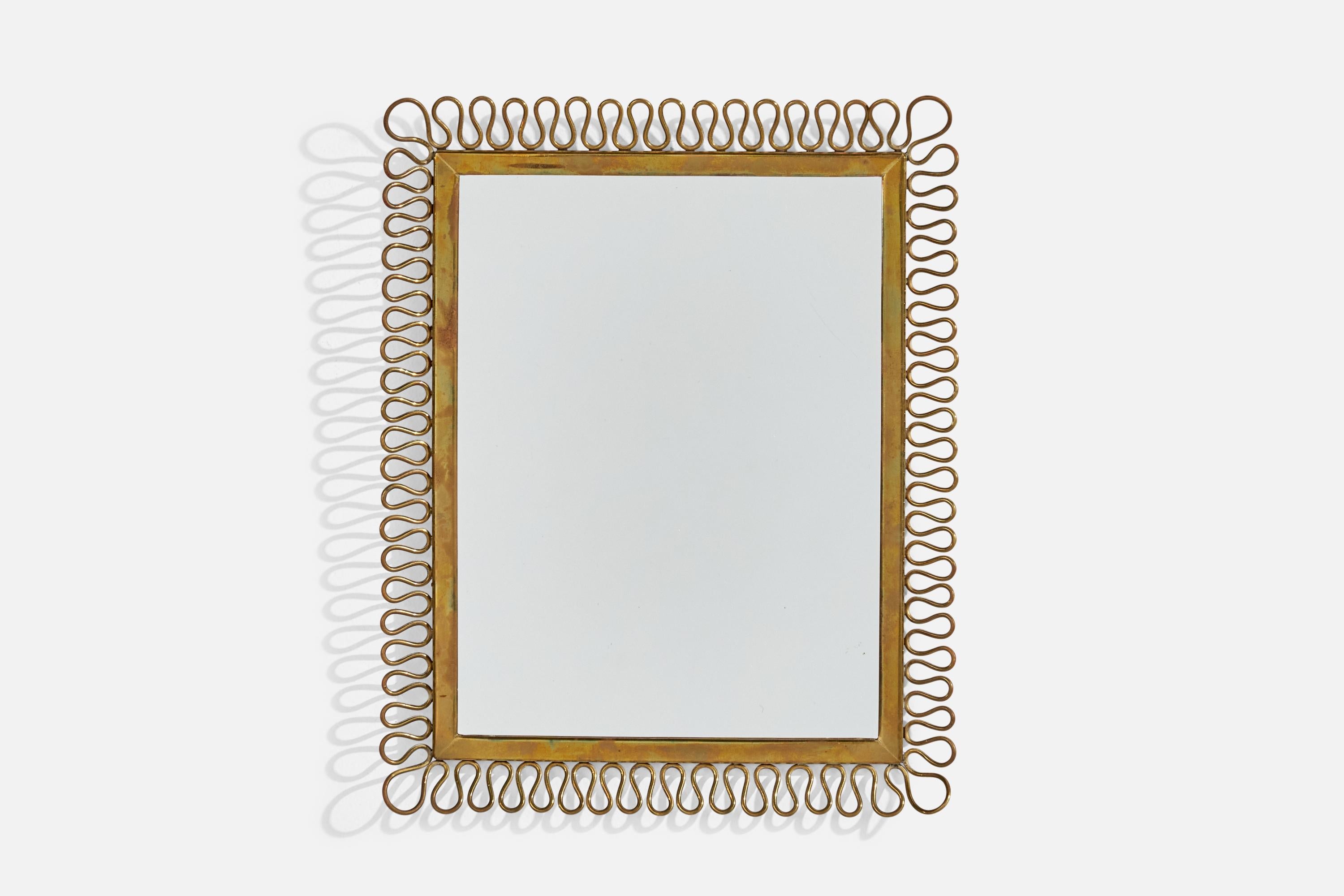 A brass wall mirror designed and produced in Italy, c. 1940s.
 