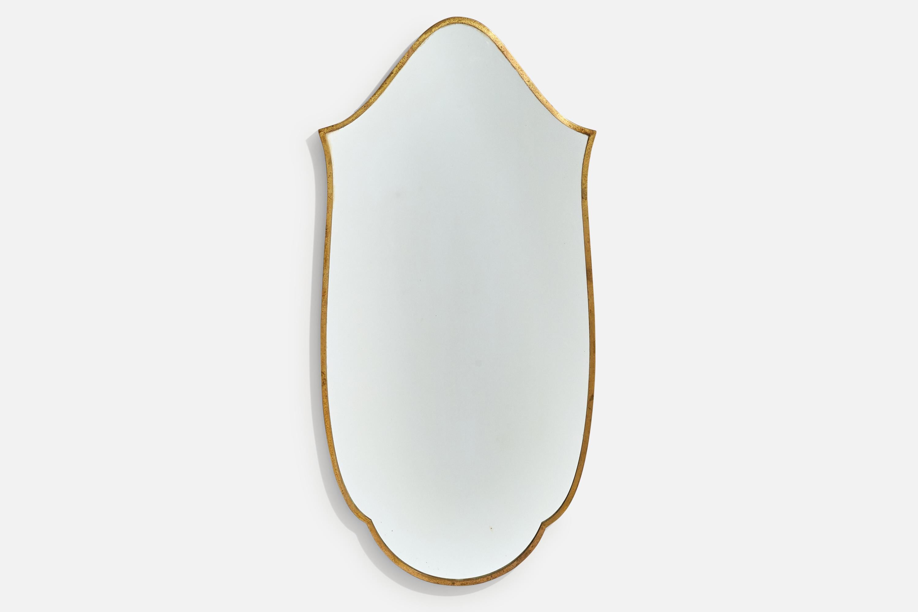 A brass wall mirror designed and produced in Italy, c. 1950s.
 