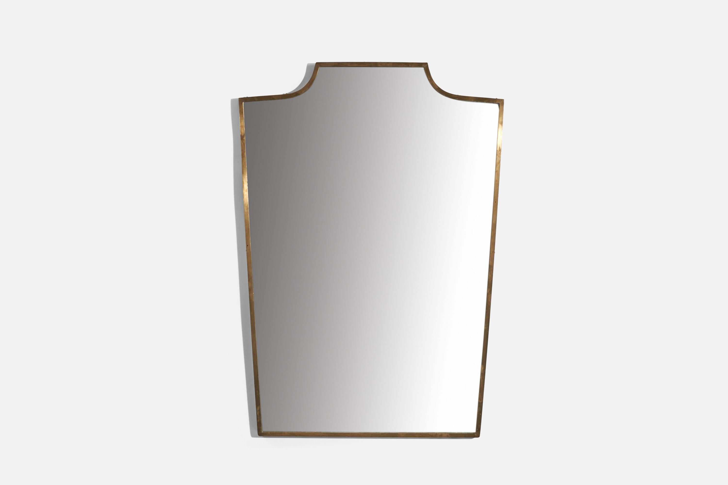 A brass wall mirror designed and produced in Italy, c. 1950s.
 