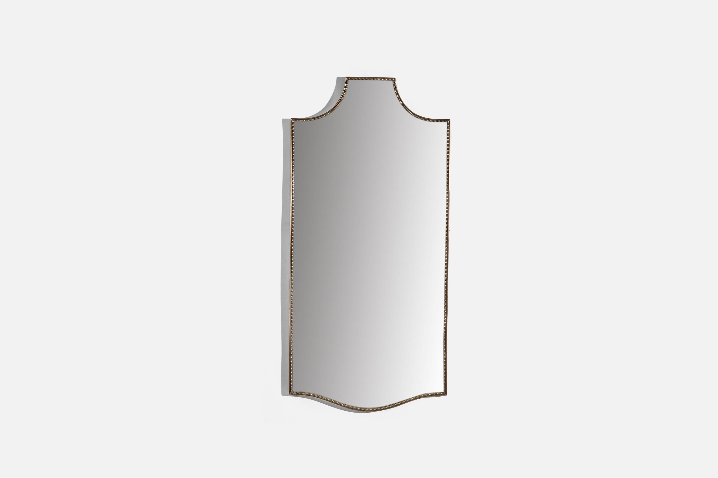 A brass wall mirror designed and produced in Italy, c. 1950s.
 