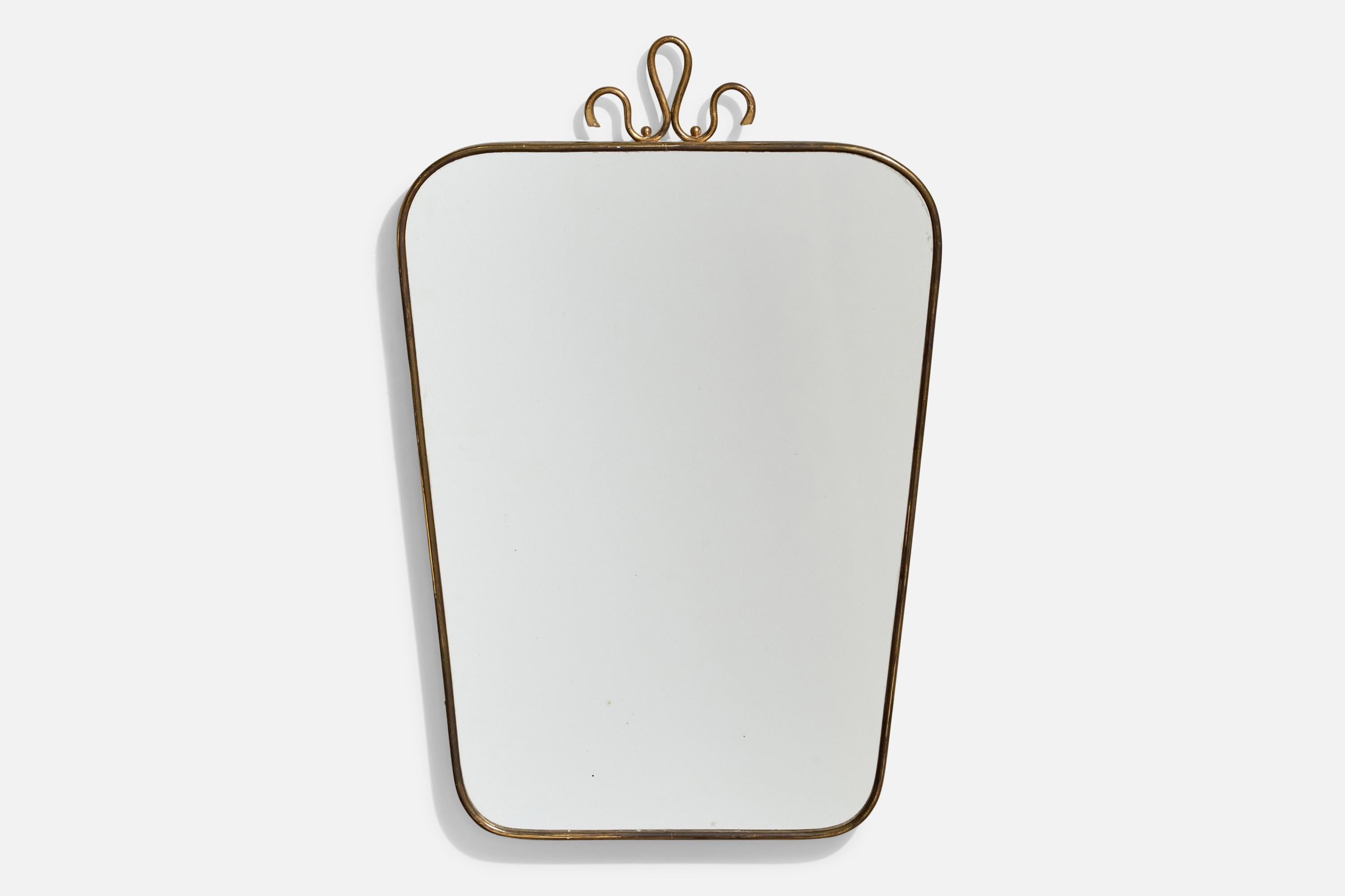 A brass wall mirror designed and produced by an Italian designer, Italy, 1940s.
 