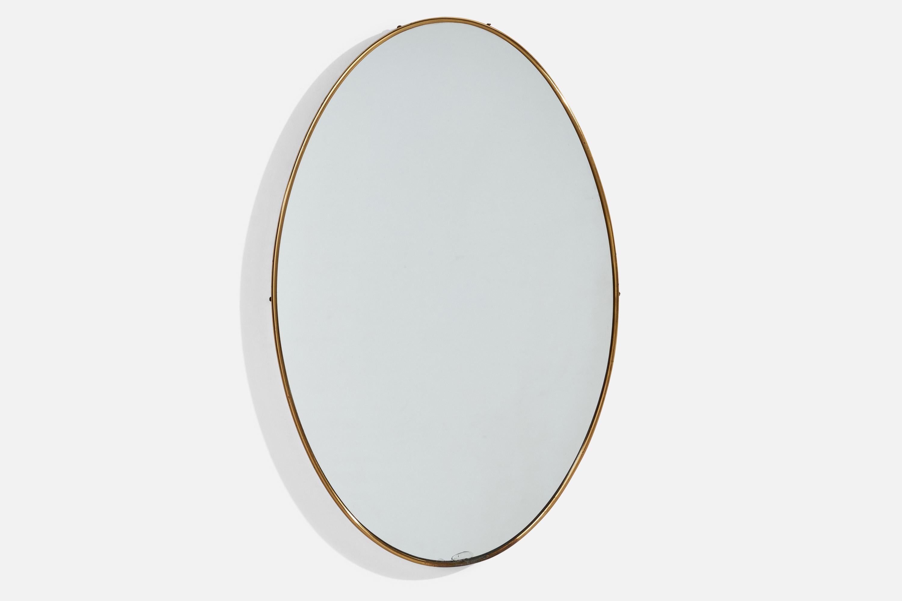 A brass wall mirror designed and produced by an Italian designer, Italy, 1940s.
 