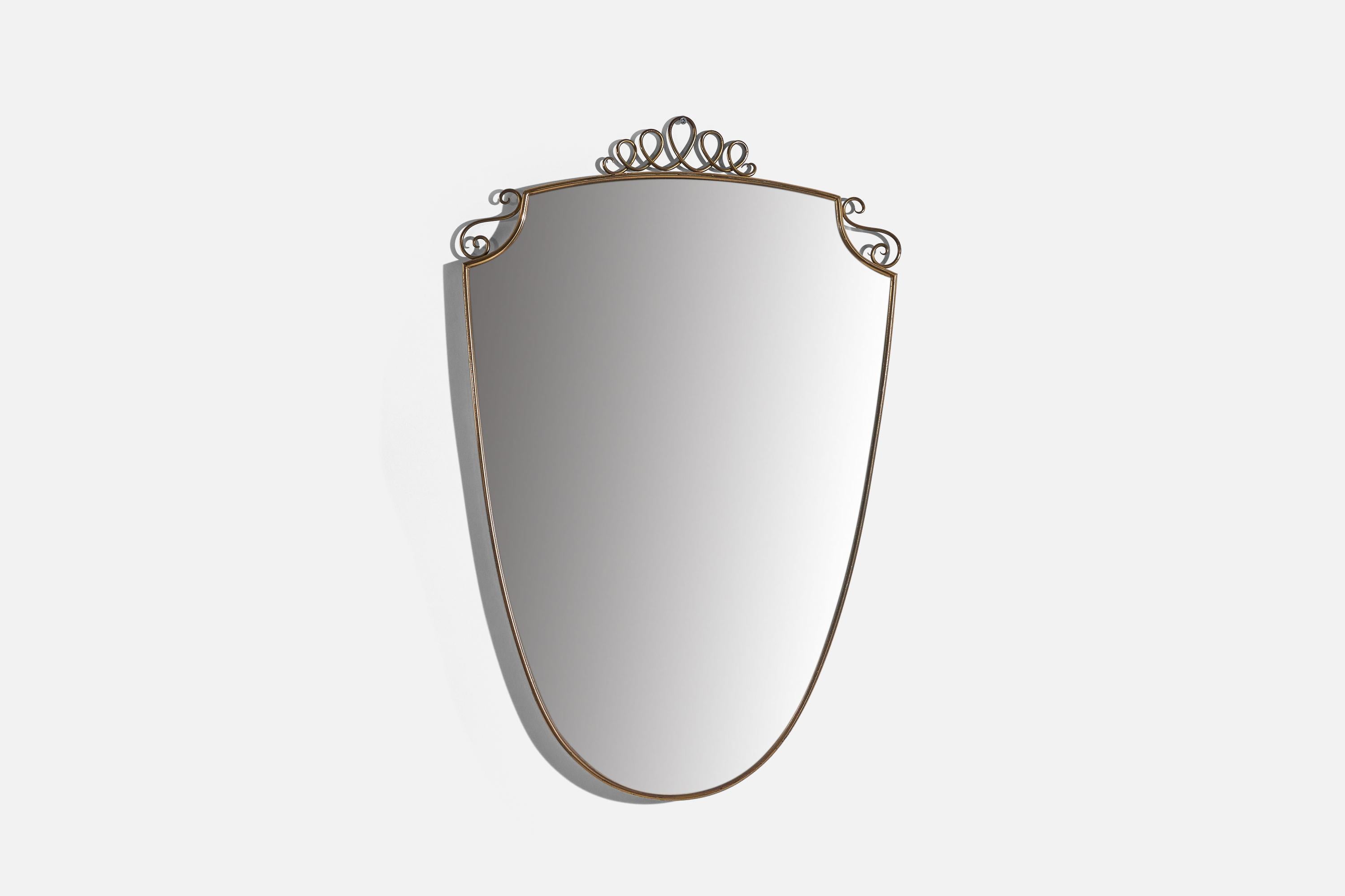 A brass wall mirror designed and produced by an Italian designer, Italy, 1940s.
   