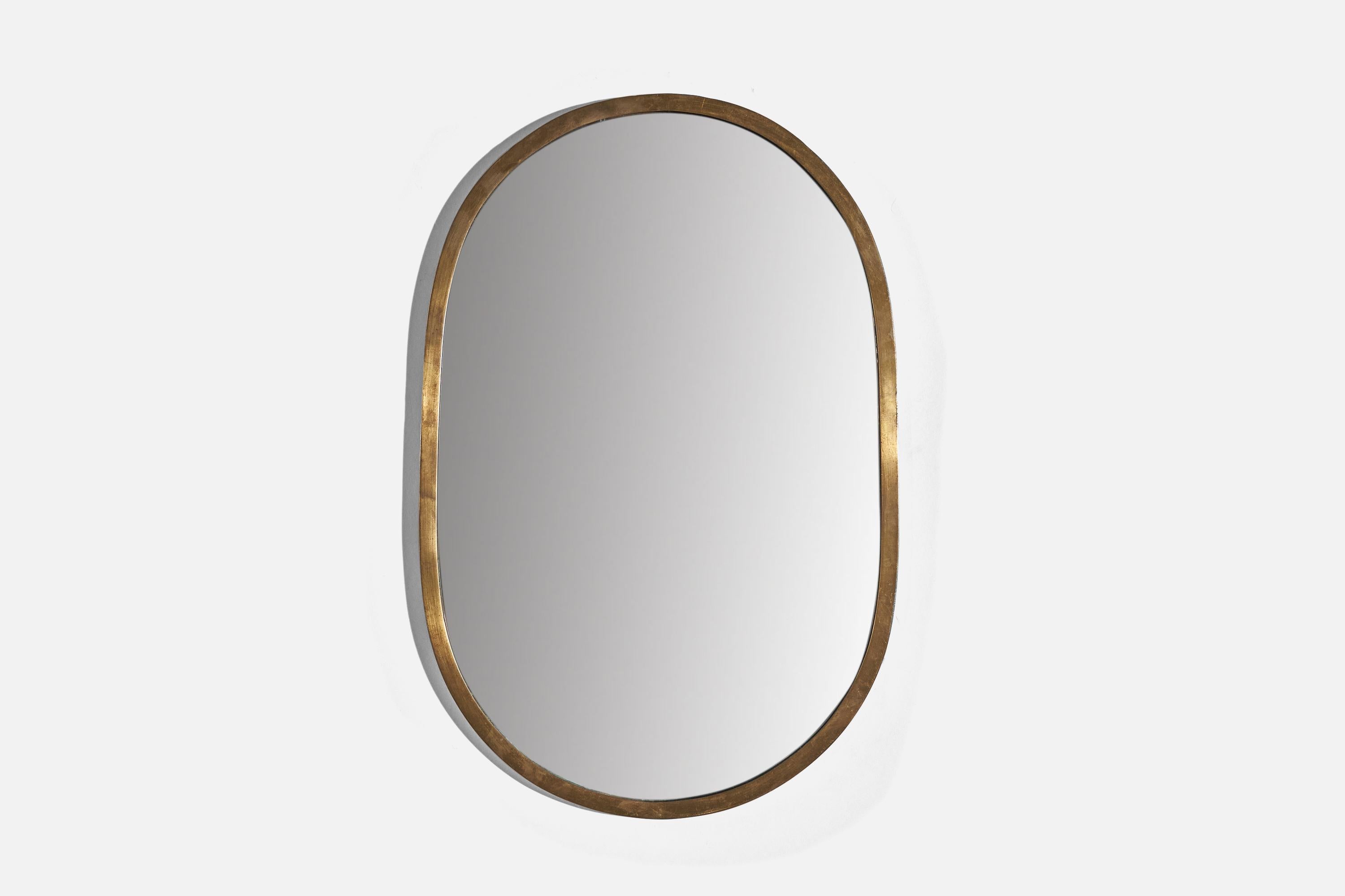 A brass wall mirror designed and produced by an Italian designer, Italy, c. 1940s.
 