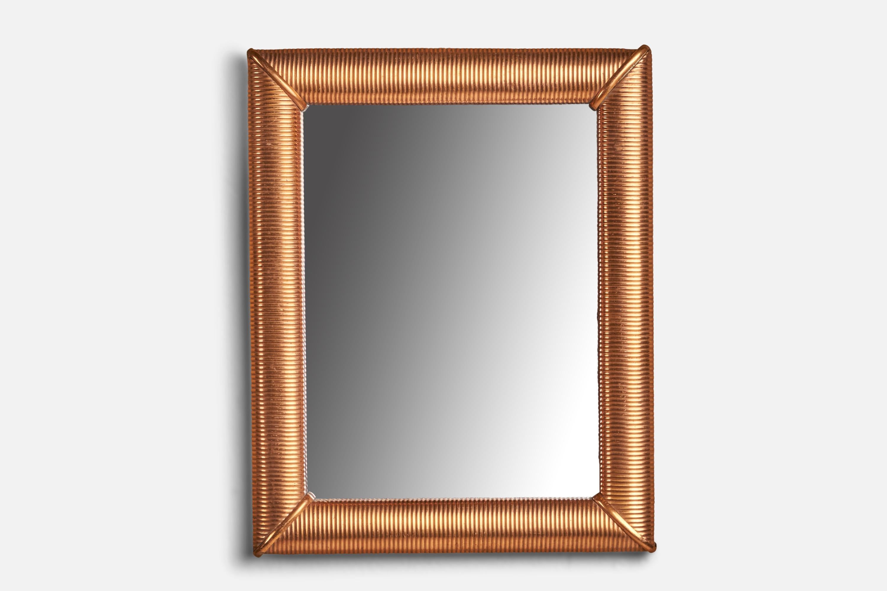 A copper wall mirror designed and produced in Italy, 1940s.
